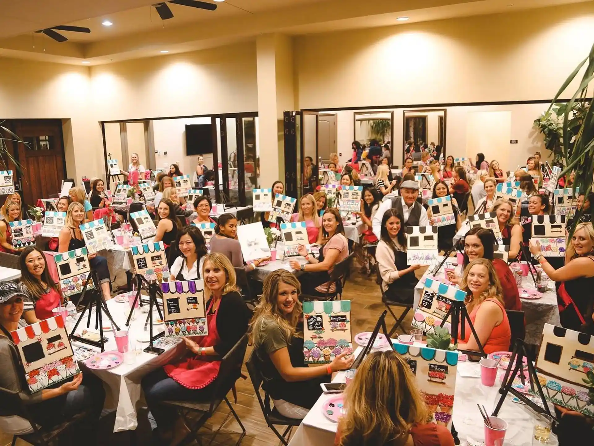 a group of people sitting at tables