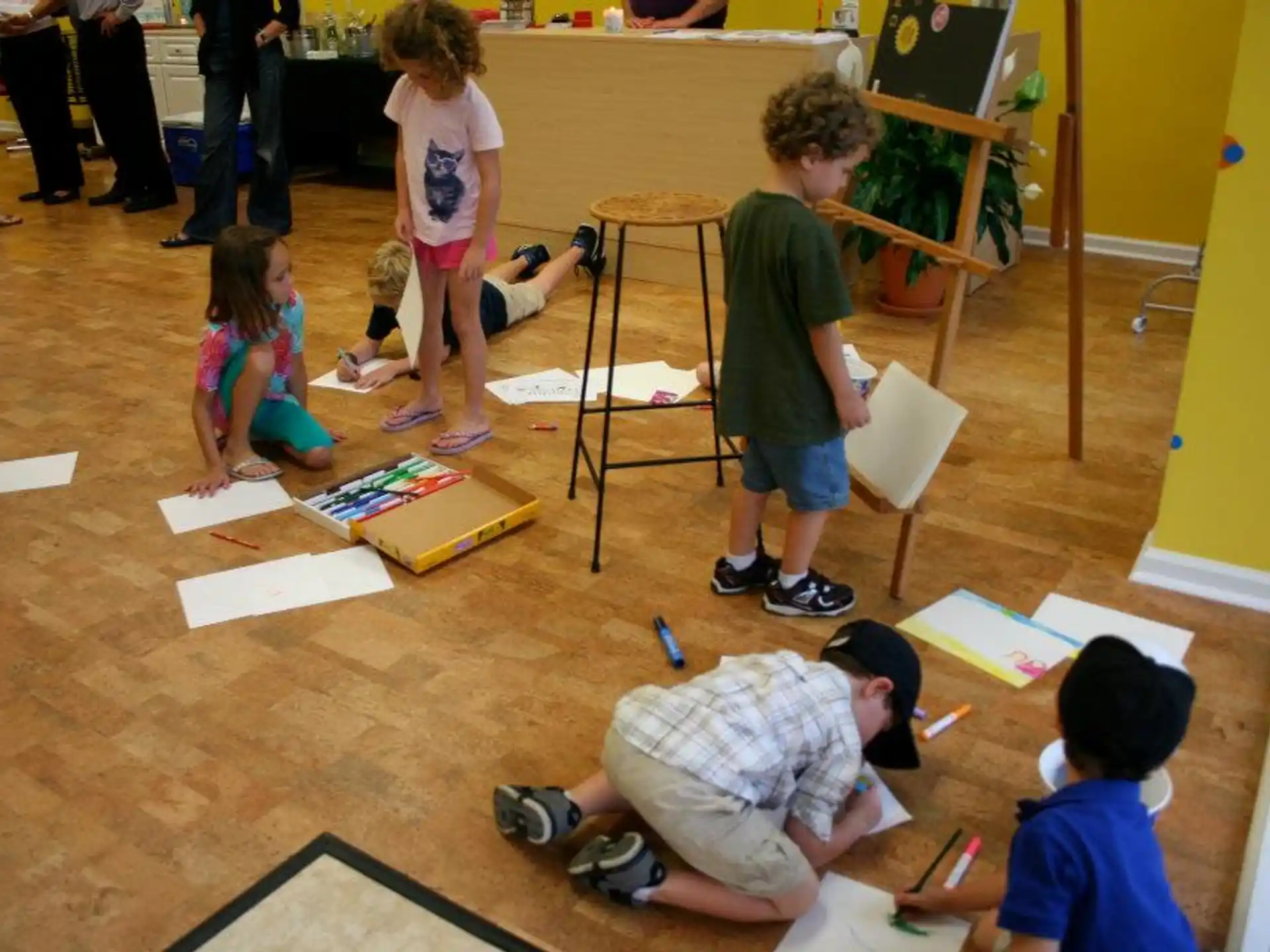 a group of children playing with paper