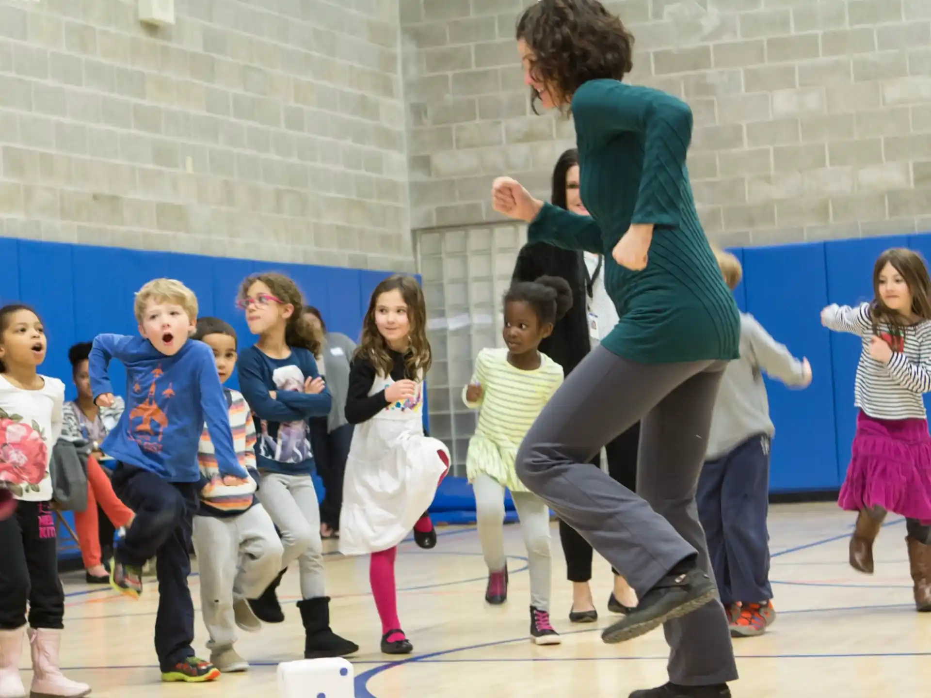a person dancing with children