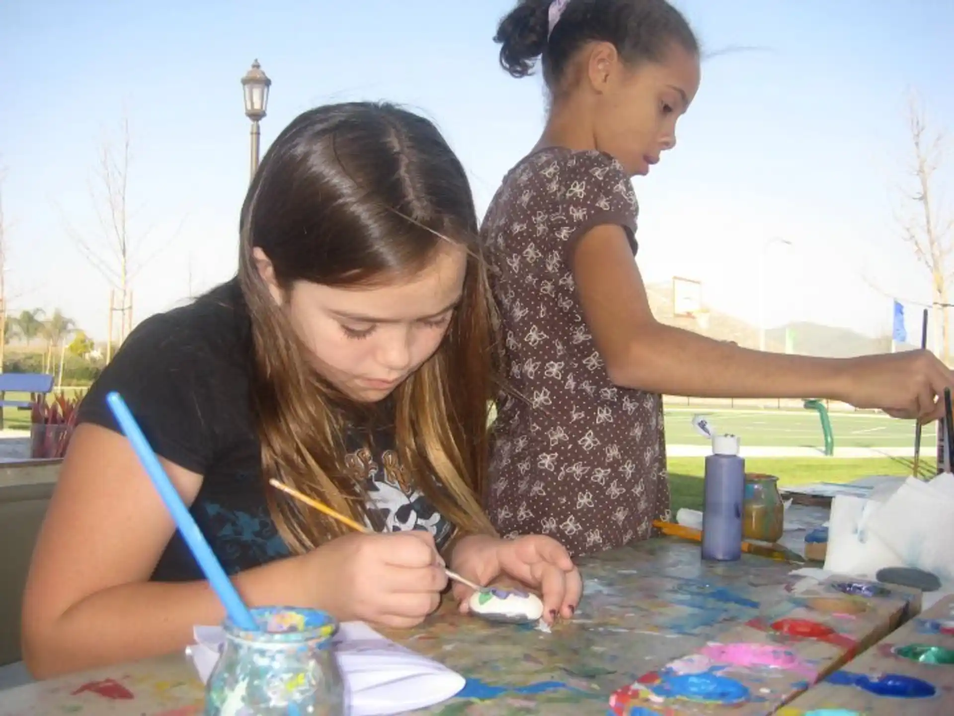 a person painting on a table