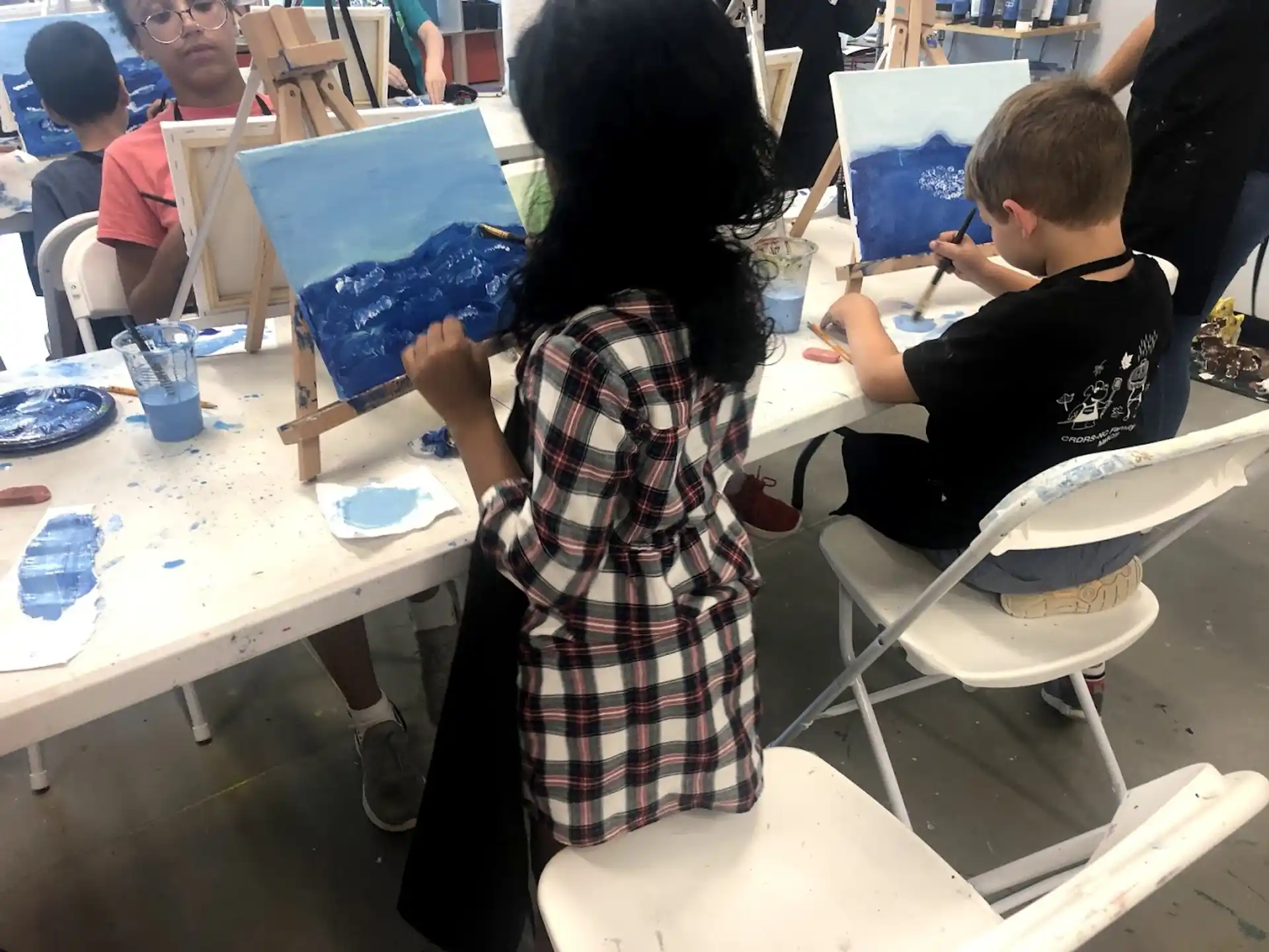 a group of children painting