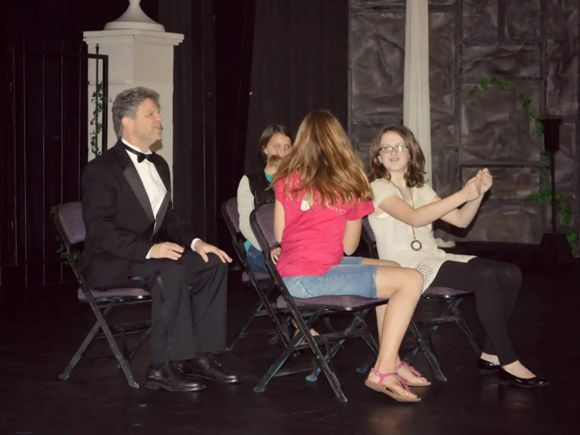 a group of people sitting in chairs