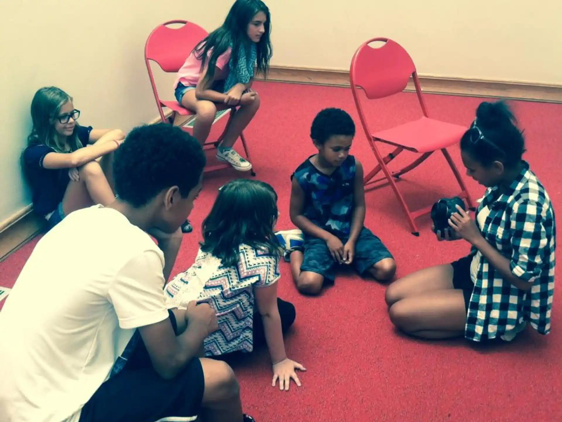 a group of people sitting on the floor