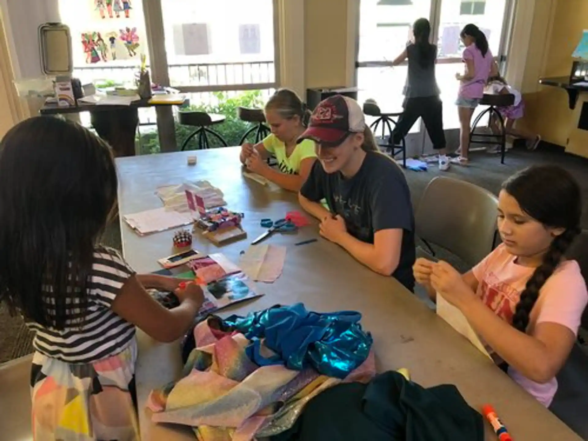 a group of people sitting around a table