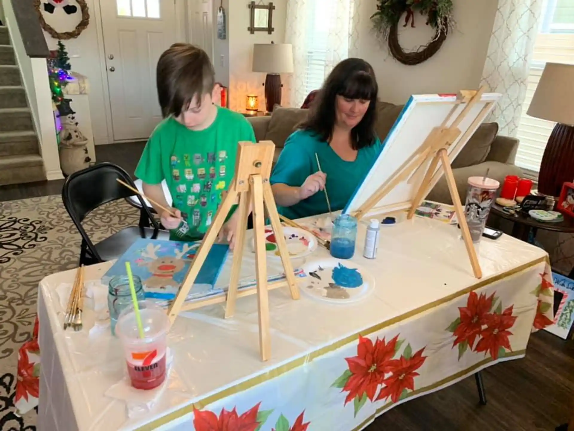 a couple of women painting