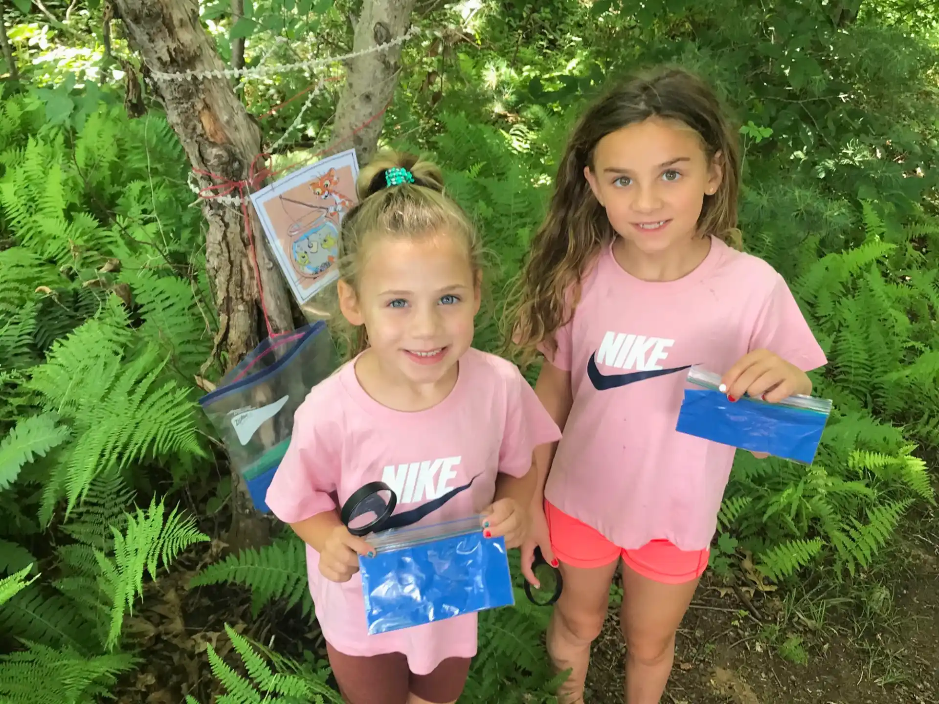 two girls in pink shirts