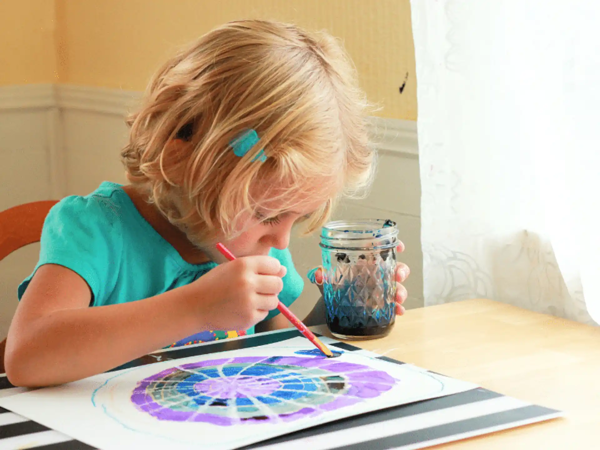 a young girl painting