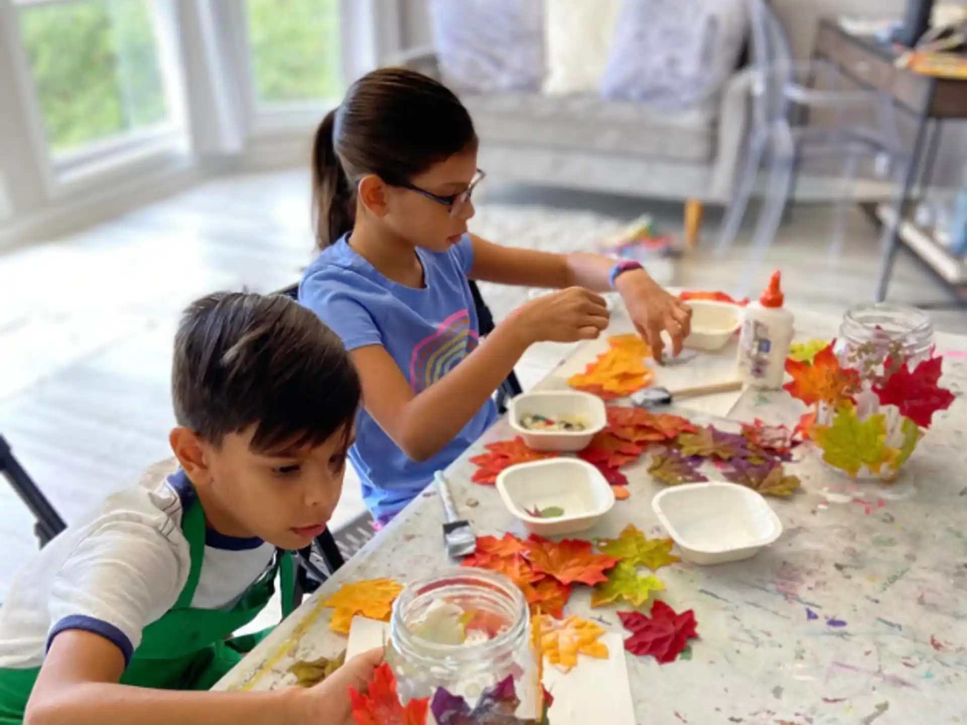 a person and a boy eating at a table