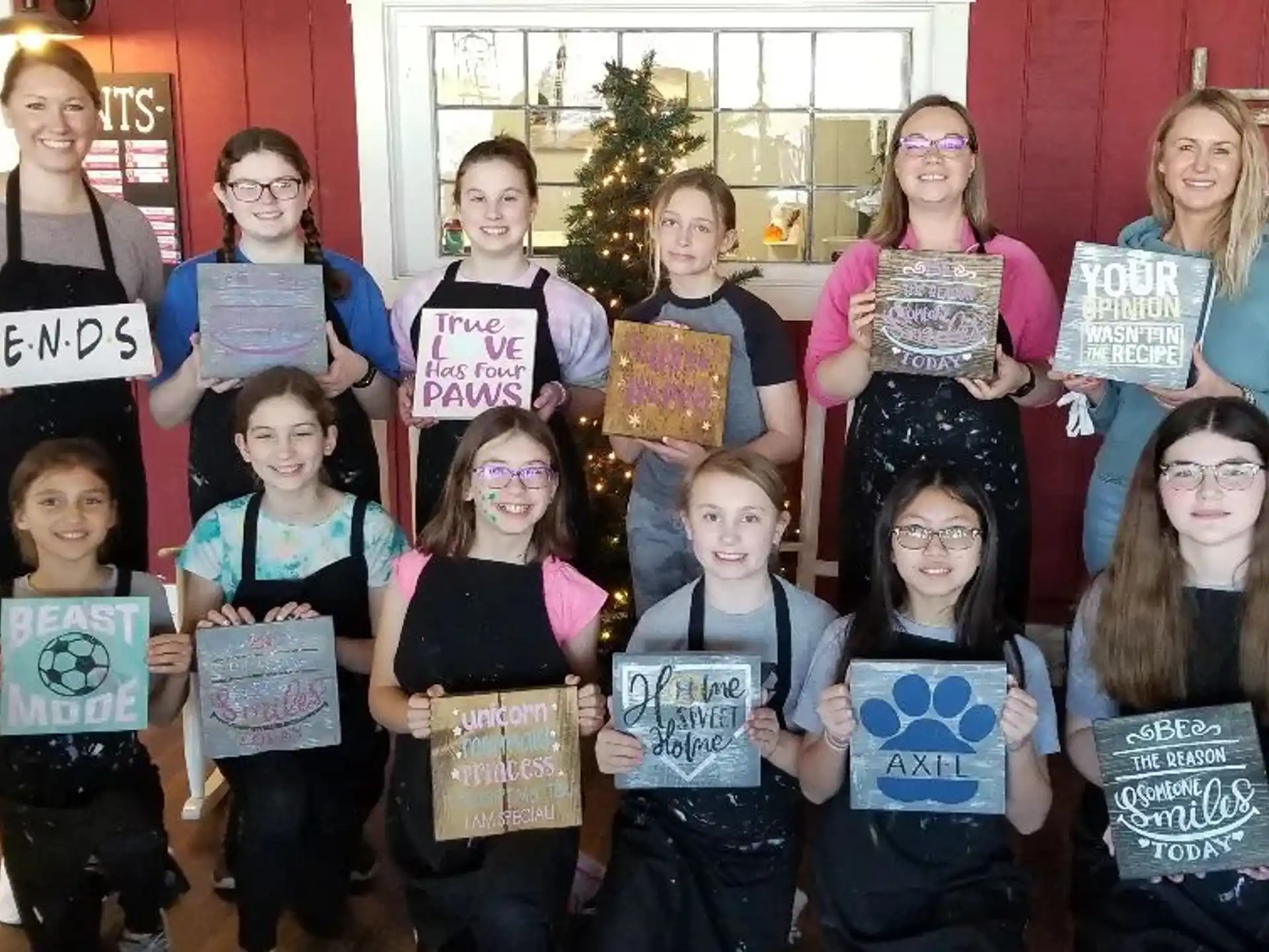 a group of children holding signs