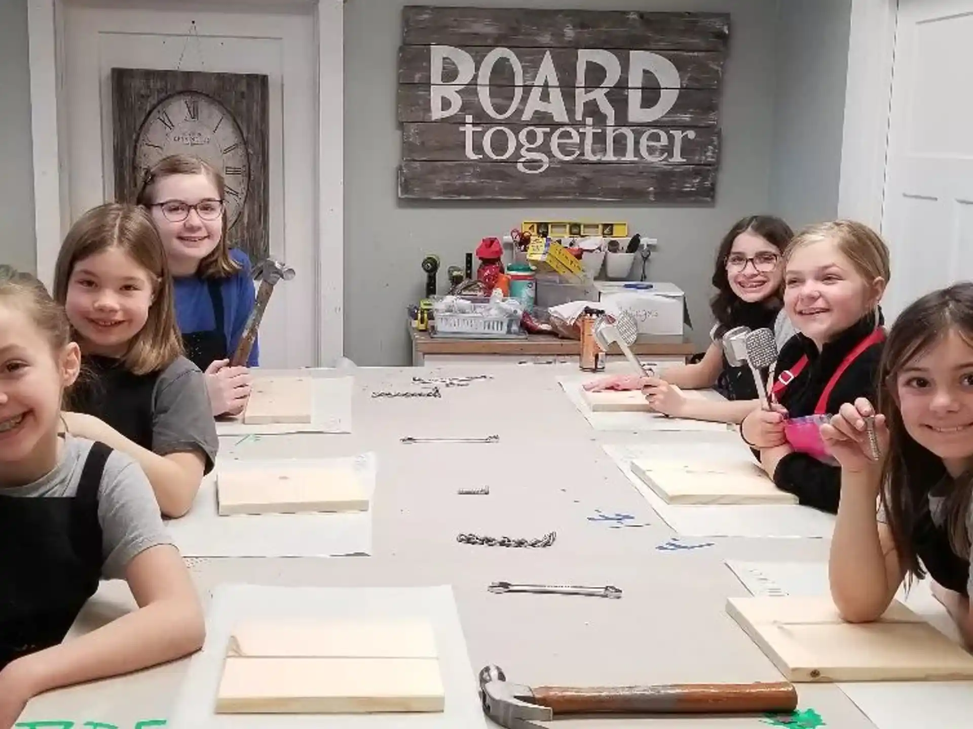 a group of girls sitting at a table