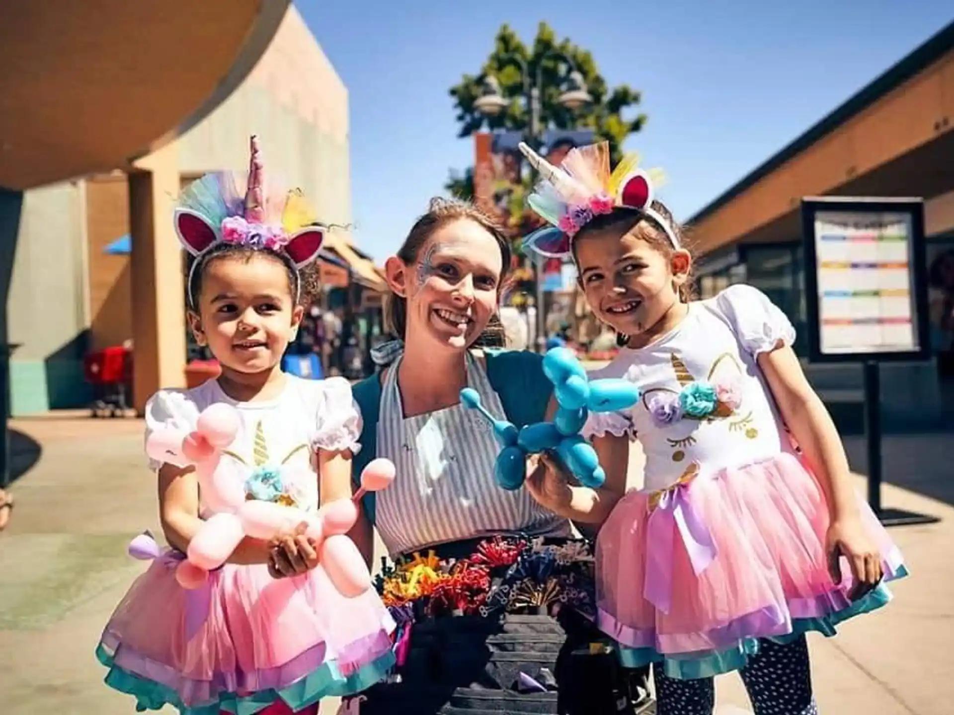 a person and two children wearing clothing