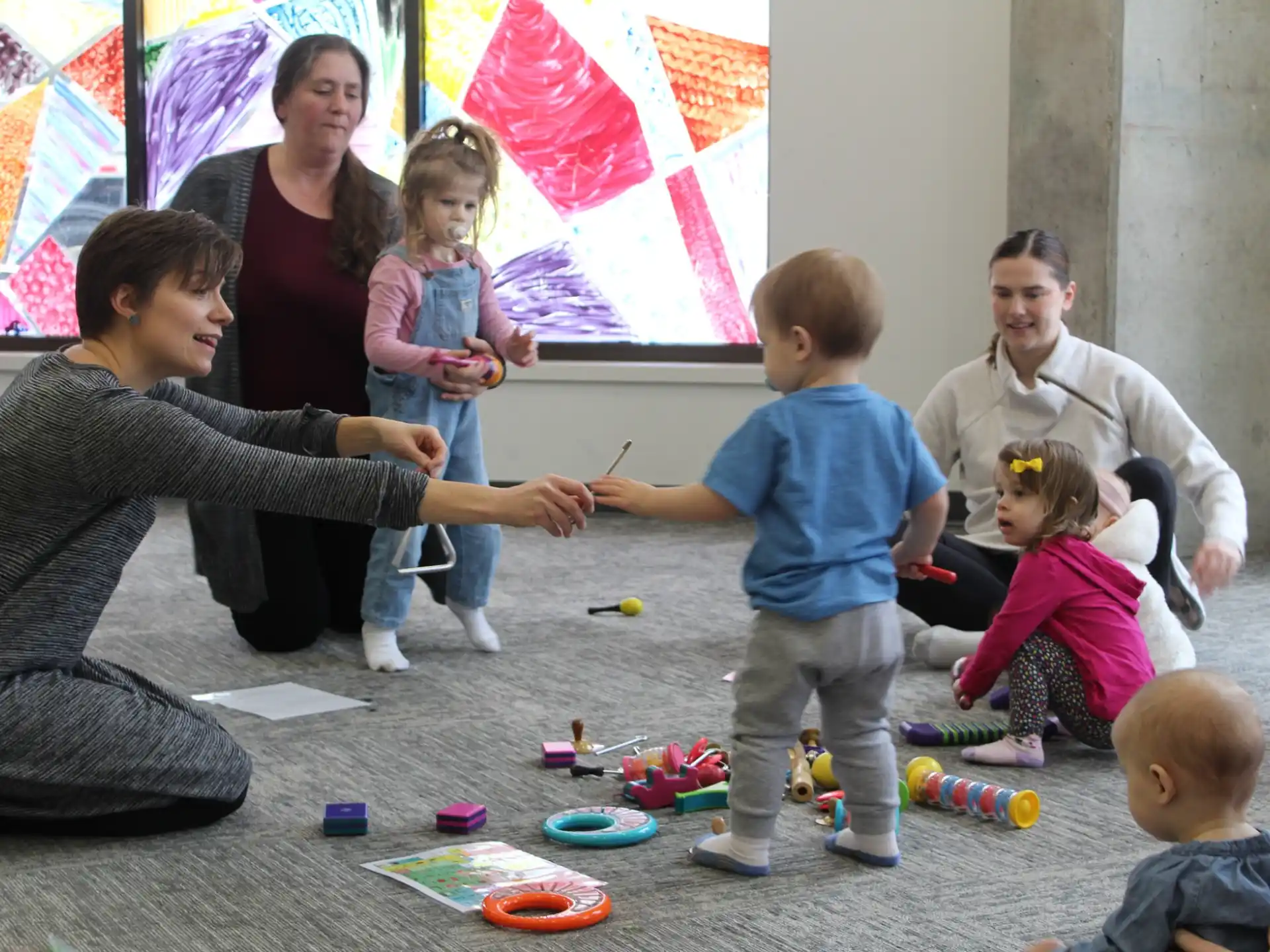 a group of people playing with toys