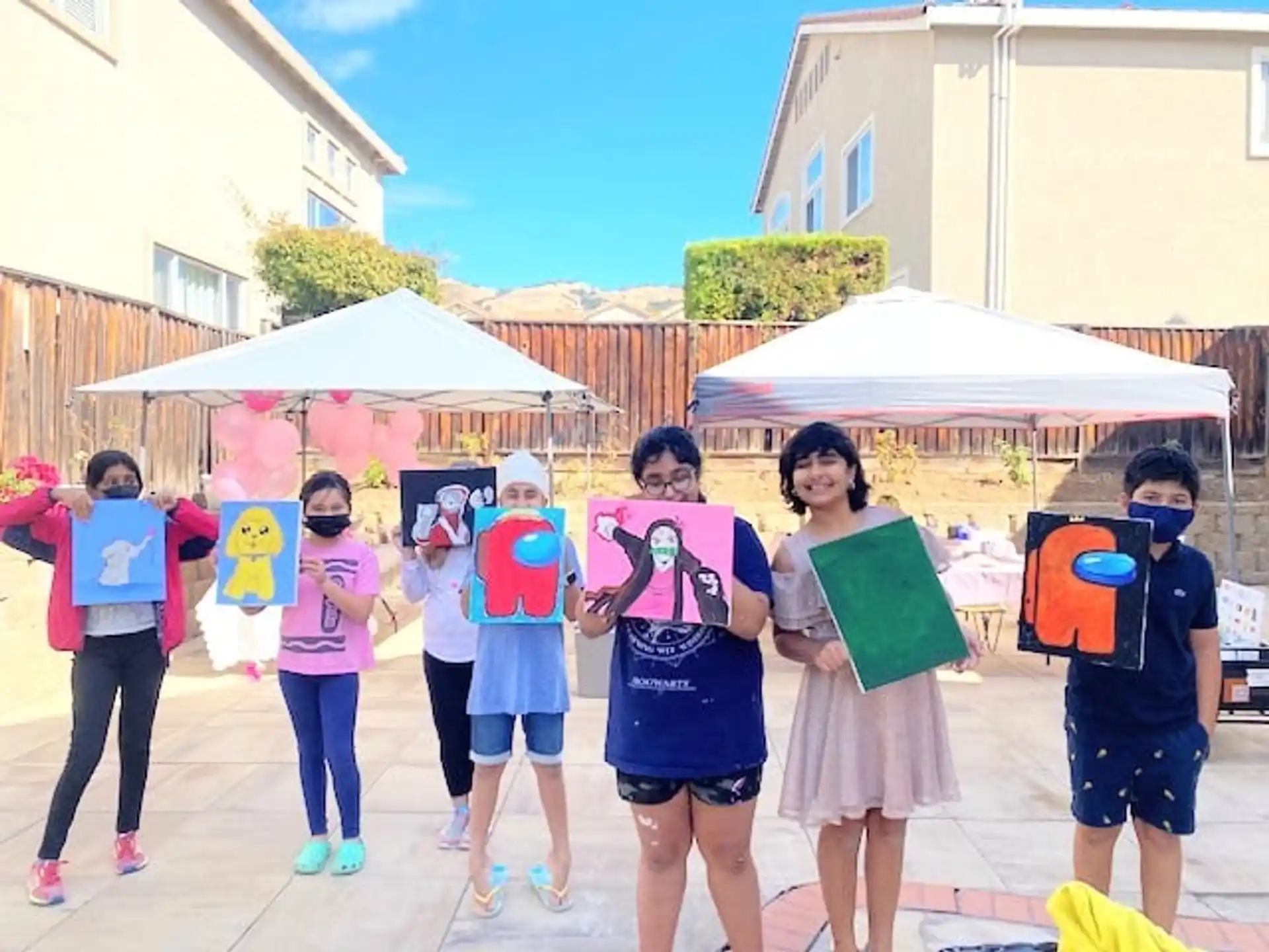 a group of children holding signs