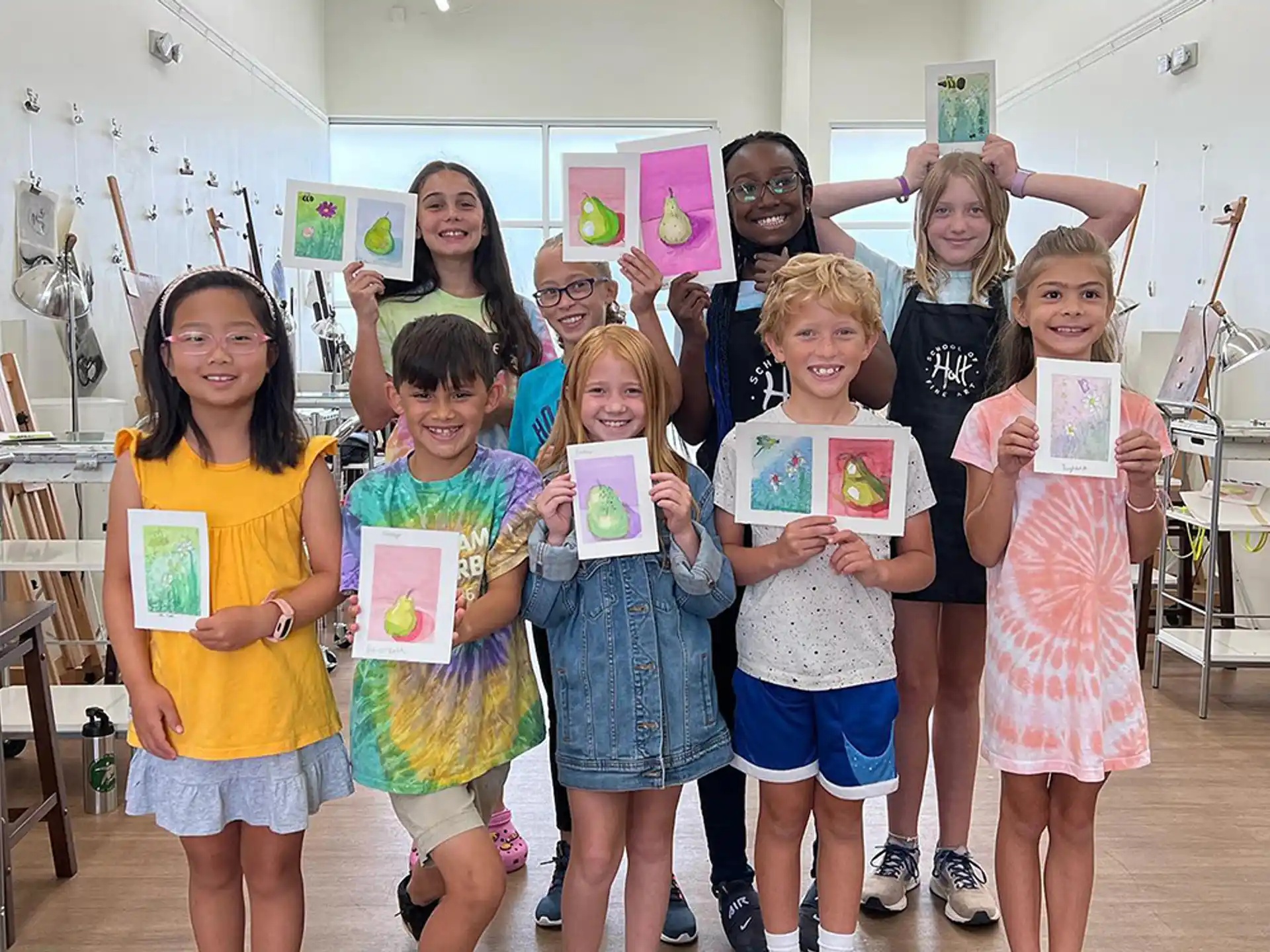 a group of children holding certificates