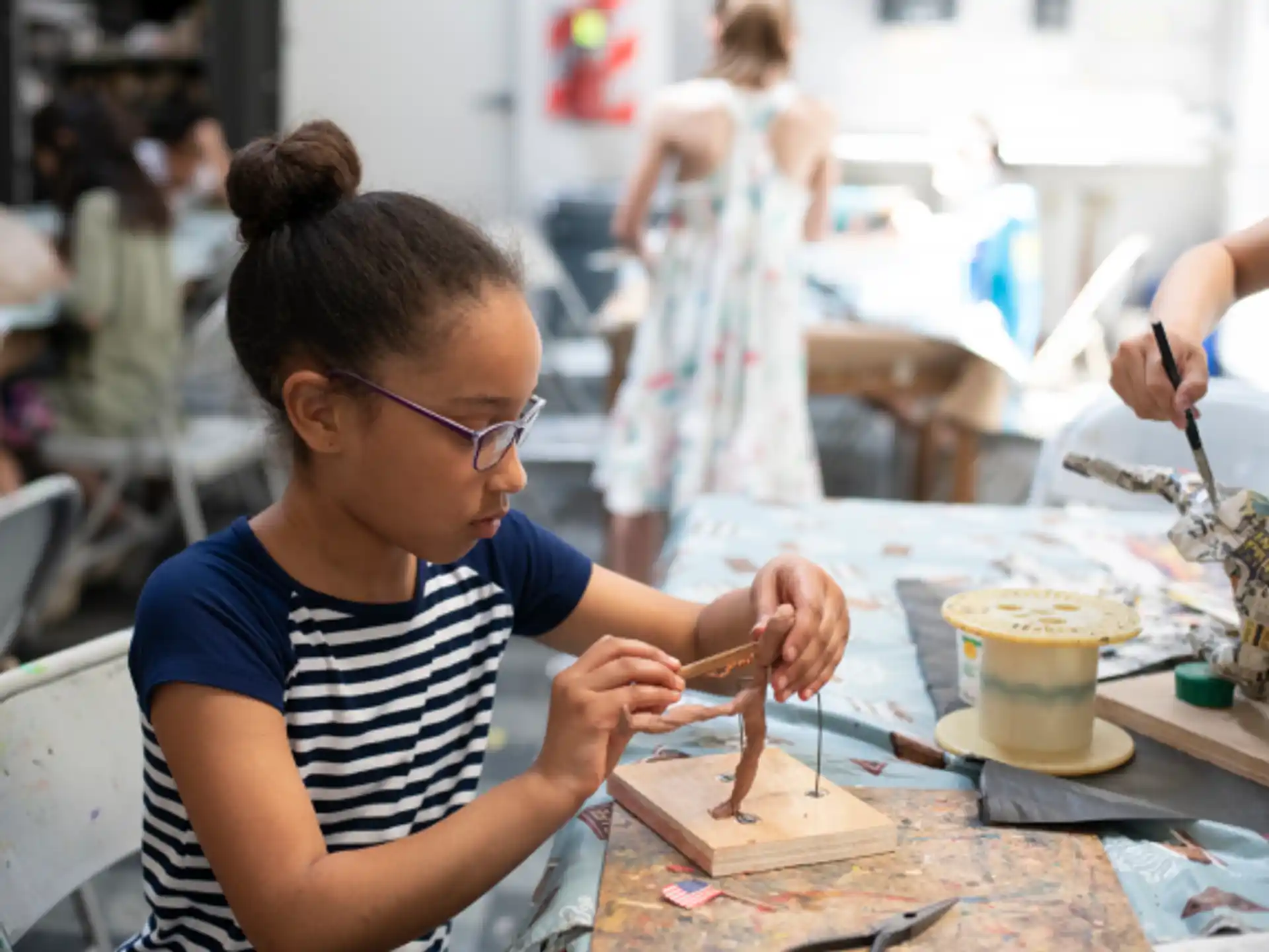 a young girl painting