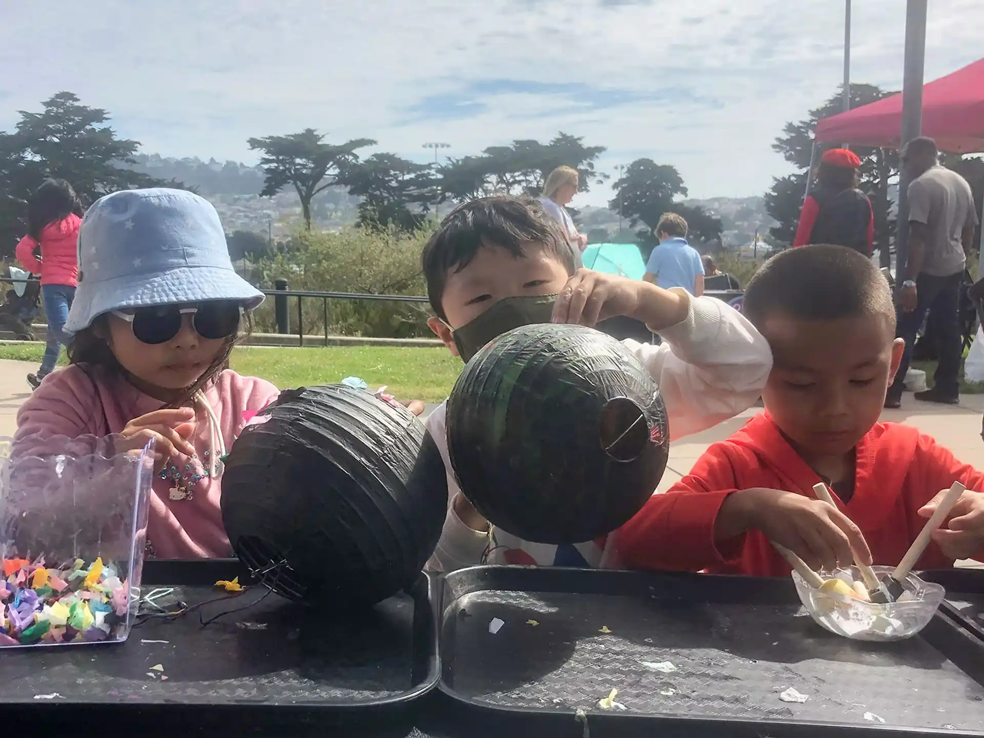 a group of children eating at a table