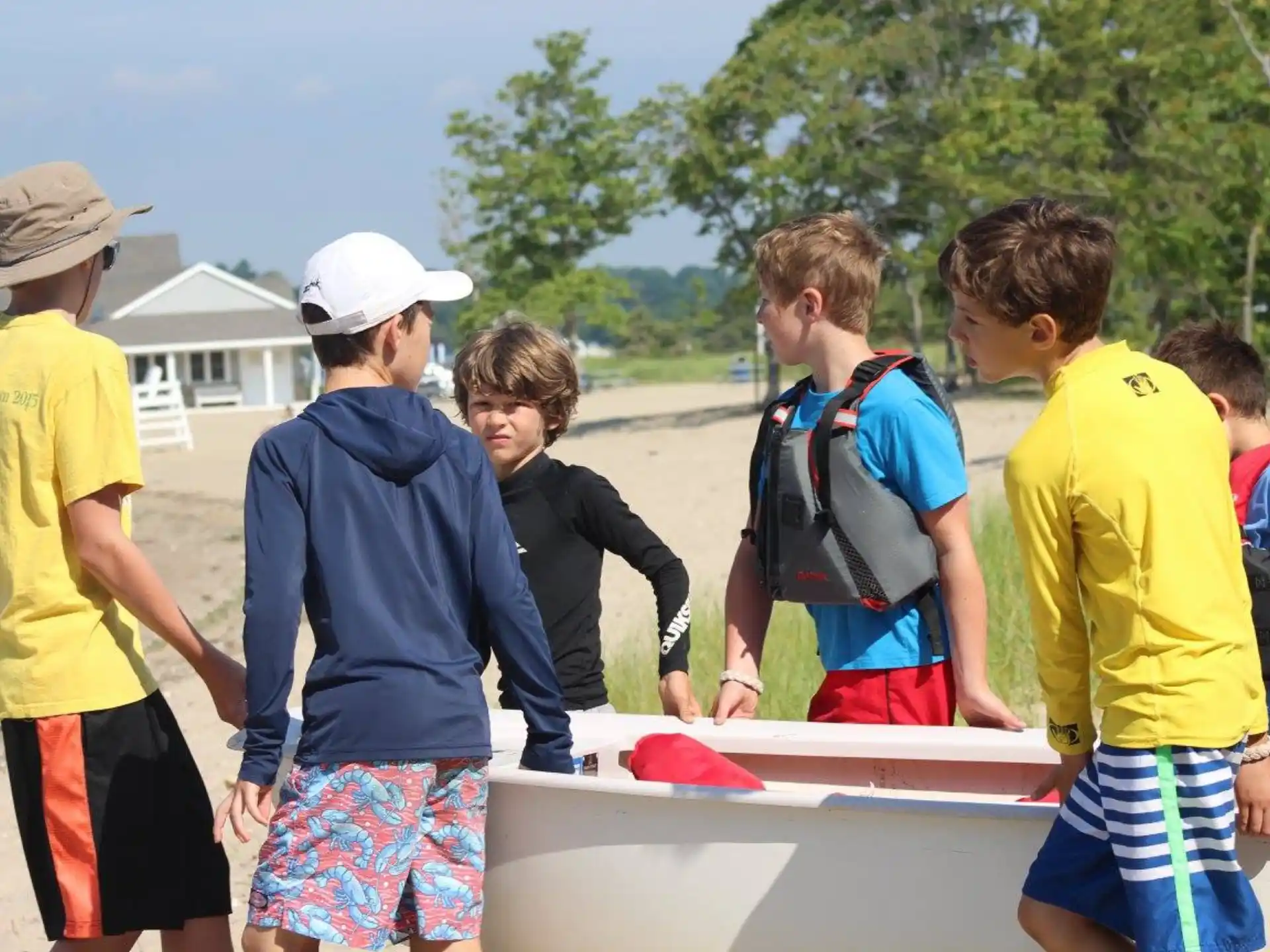 a group of boys playing with a paddle