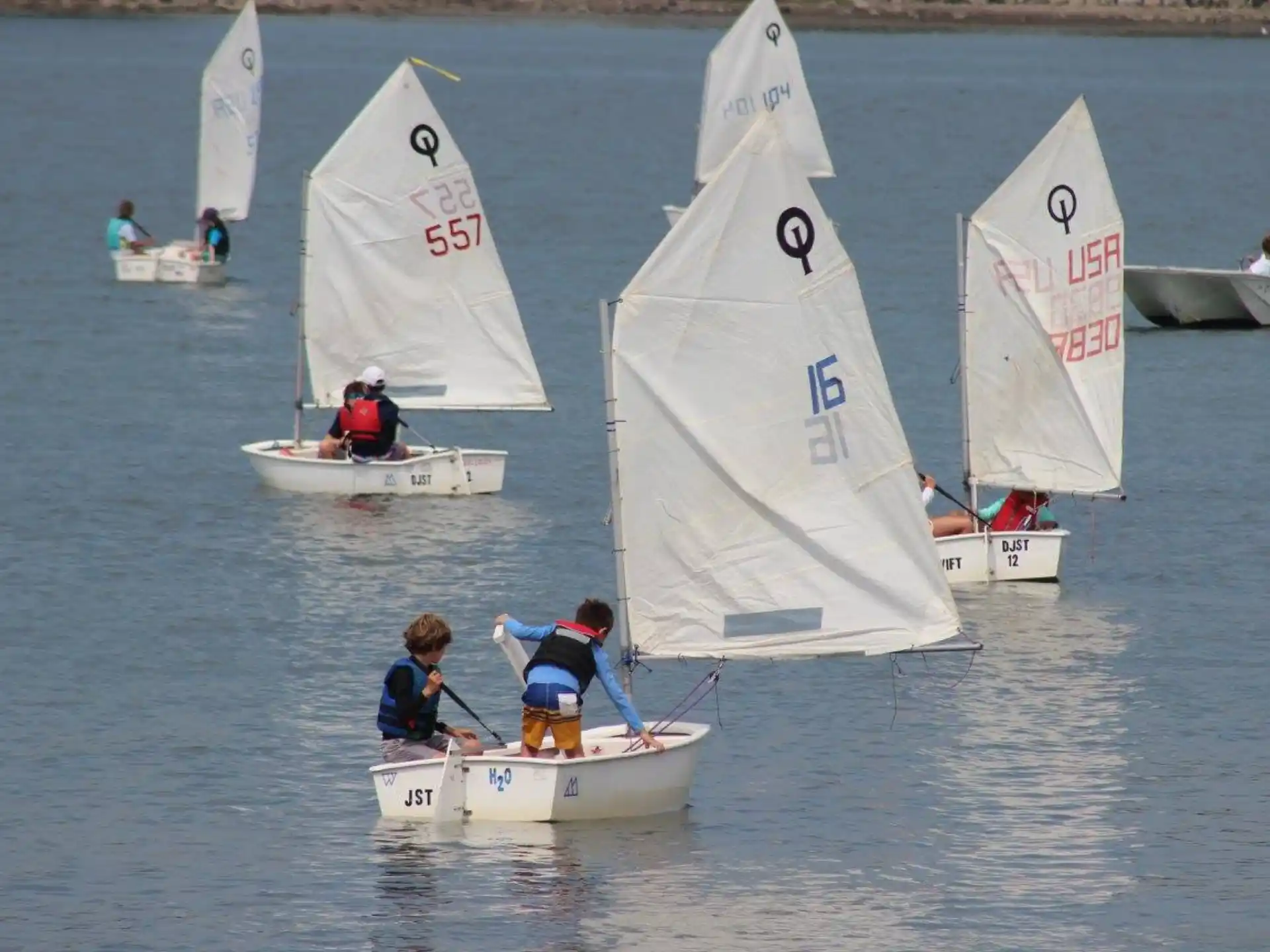 a group of people sailing on a boat