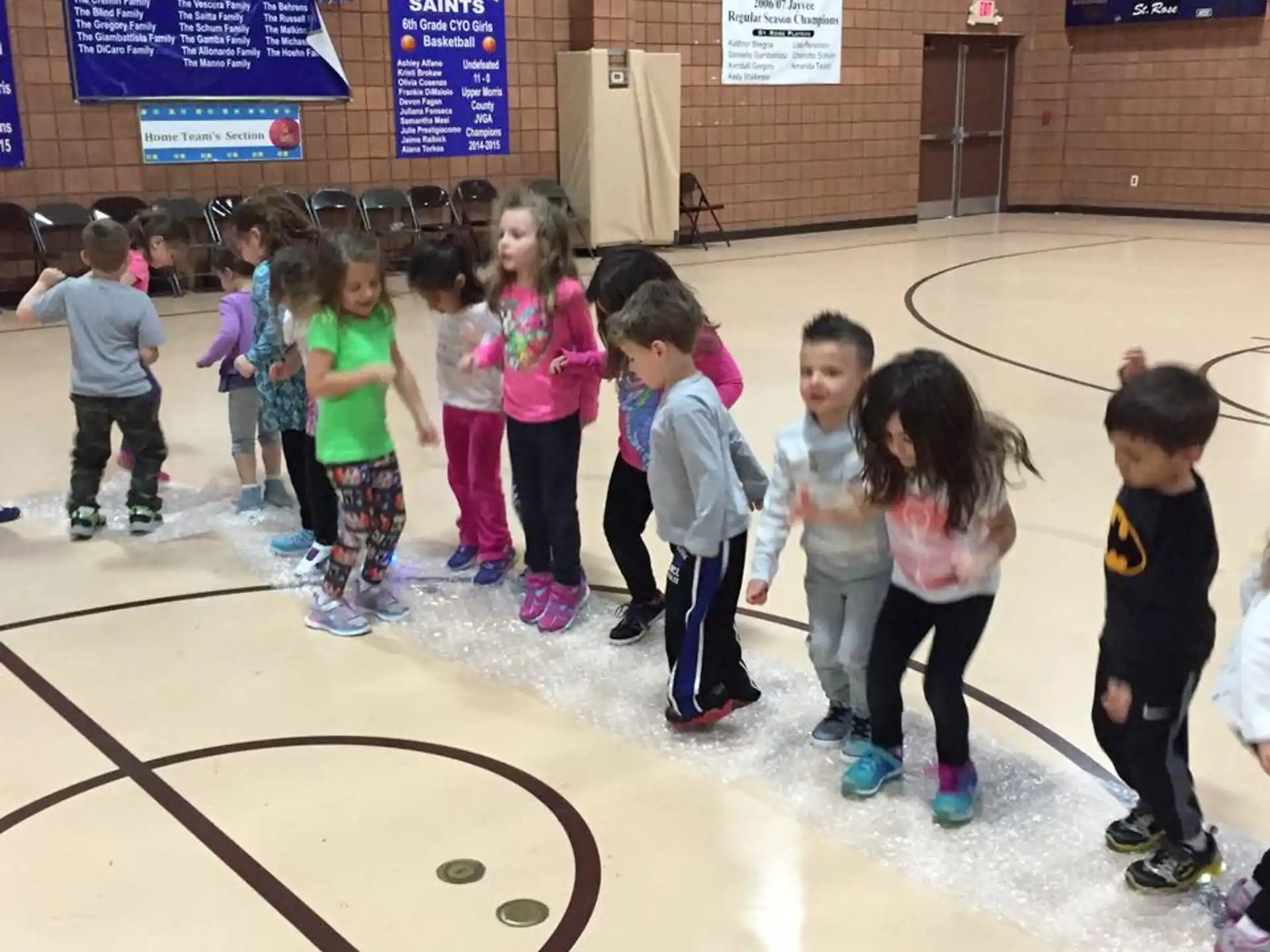 a group of children on an ice rink
