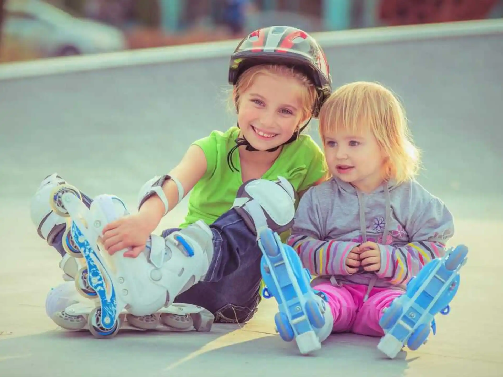 a couple of kids sit on a bench