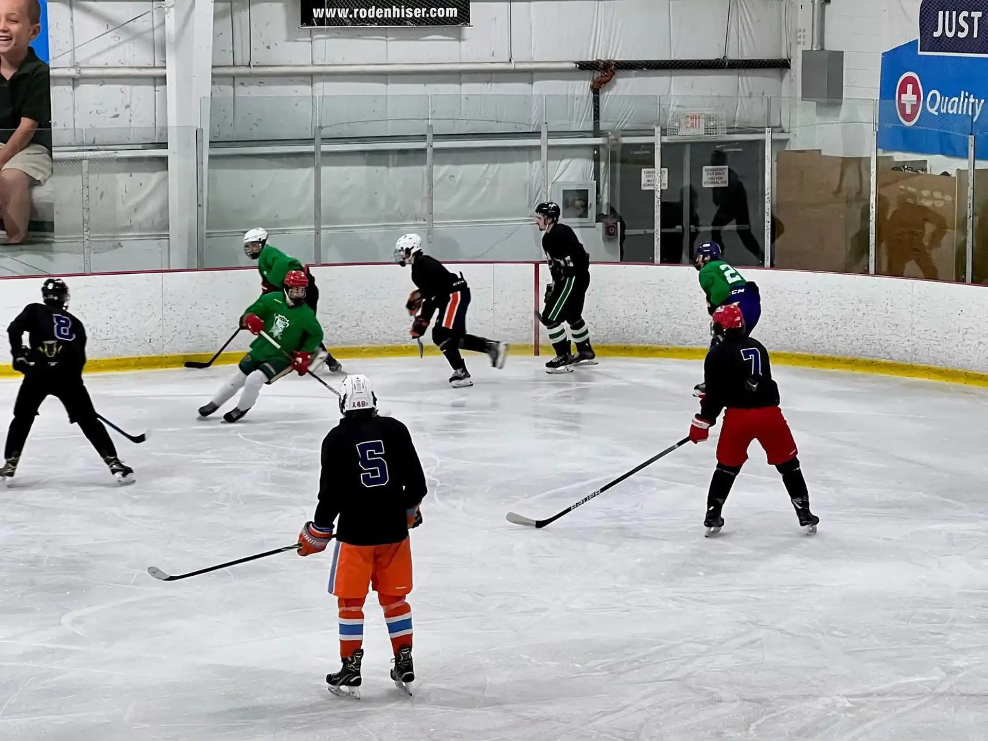 a group of people playing hockey