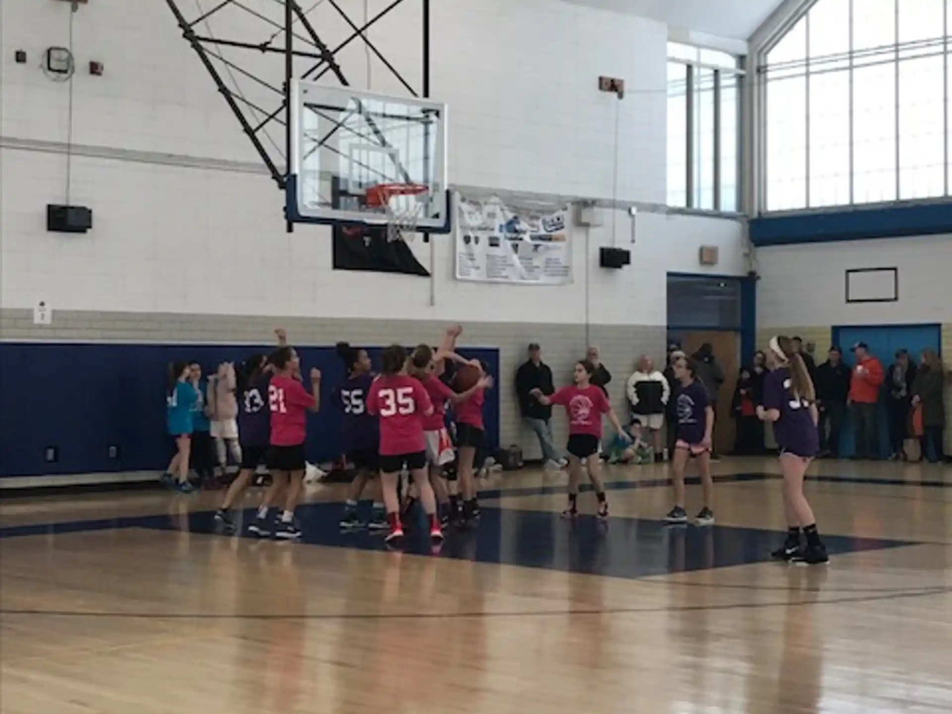 a group of people in a gym