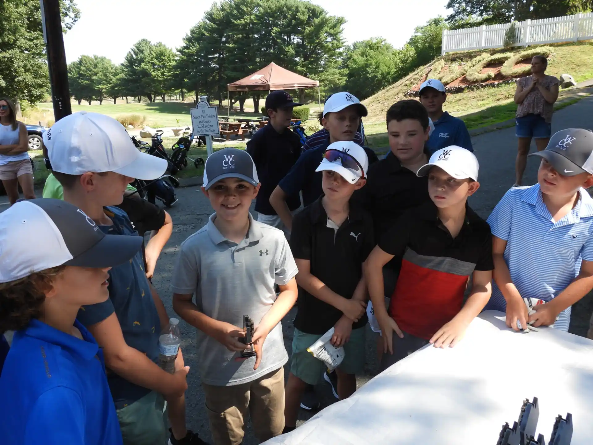 a group of people wearing white hats
