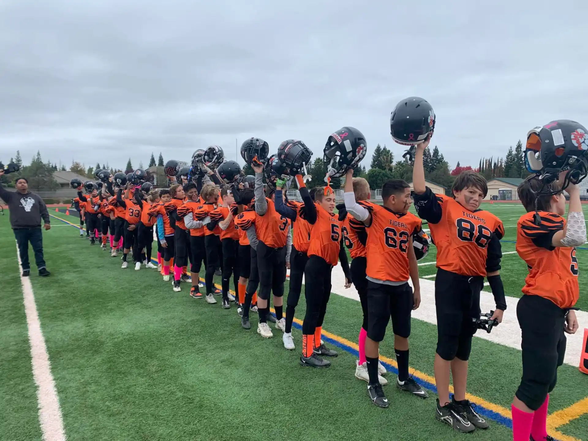 a group of kids wearing helmets