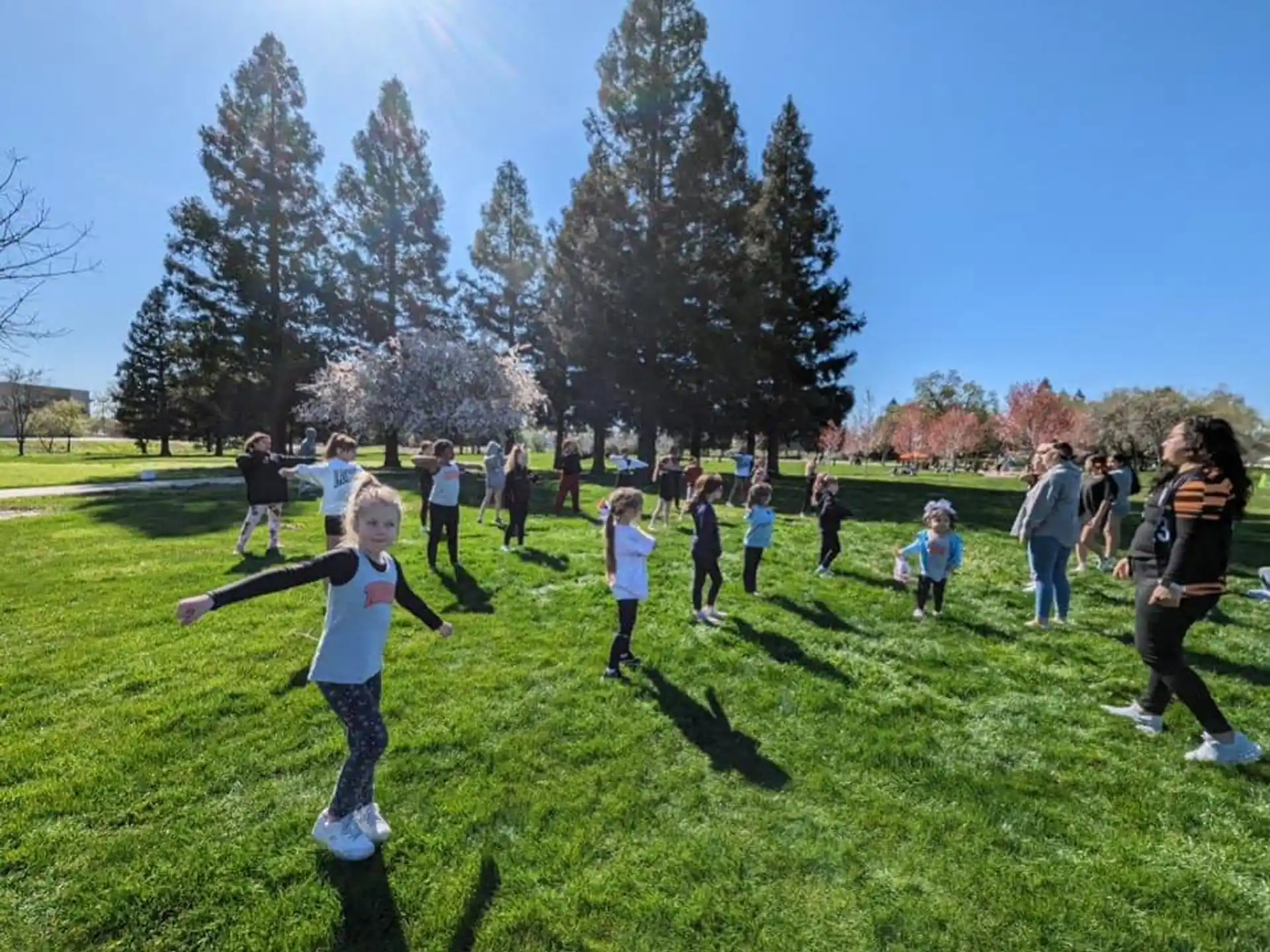 a group of people playing in a field