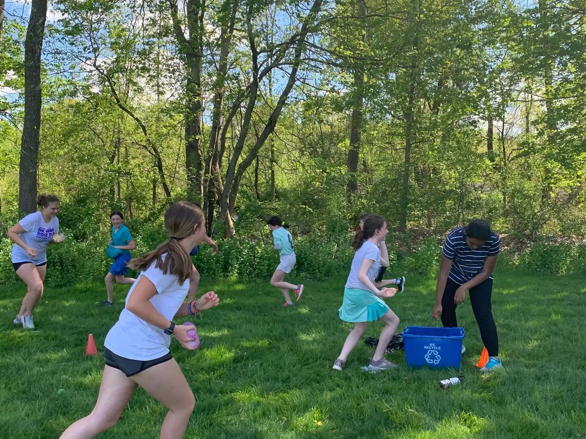 a group of people playing in a park