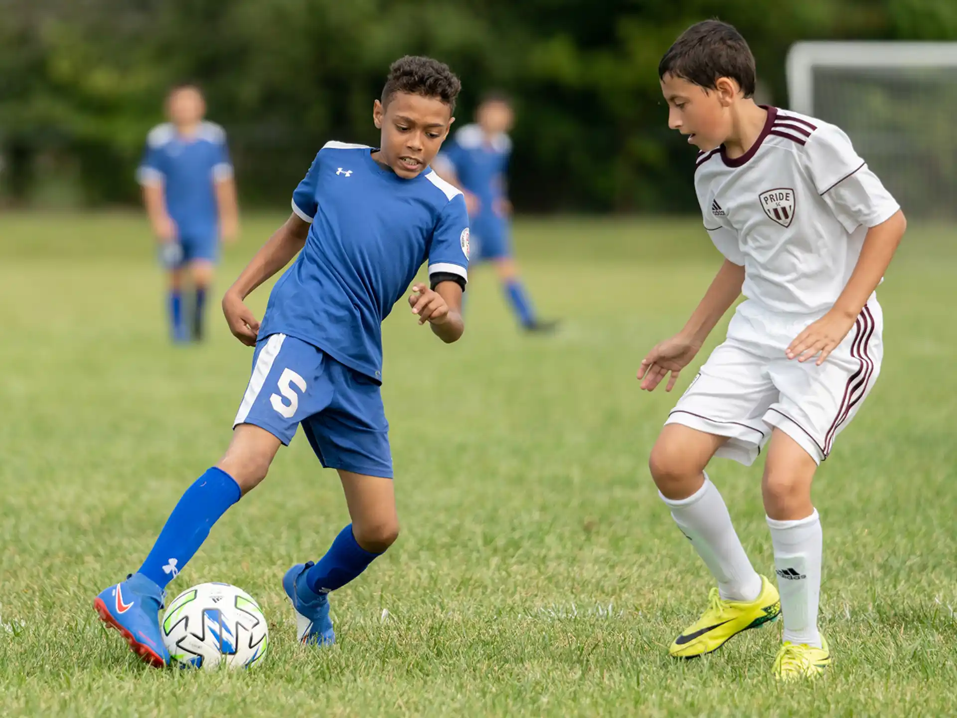 a couple of young boys playing football