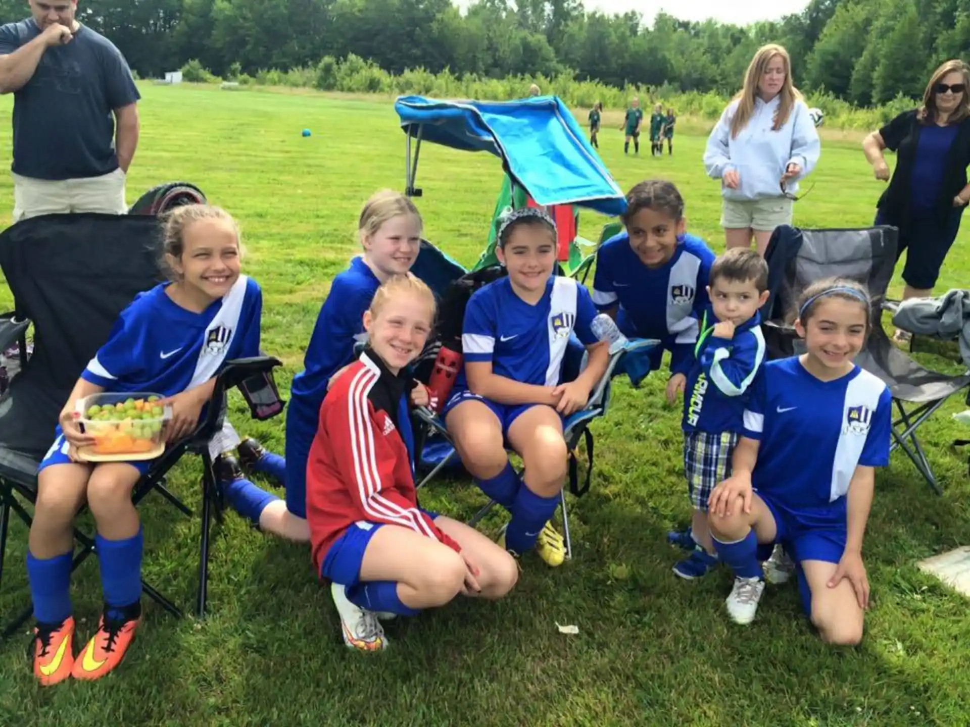 a group of kids in football uniforms