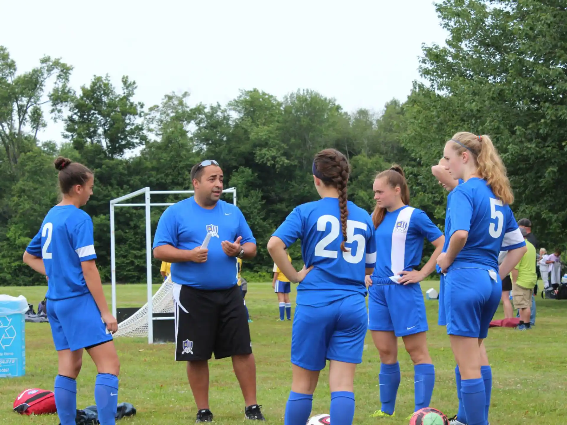 a group of people in sports uniforms