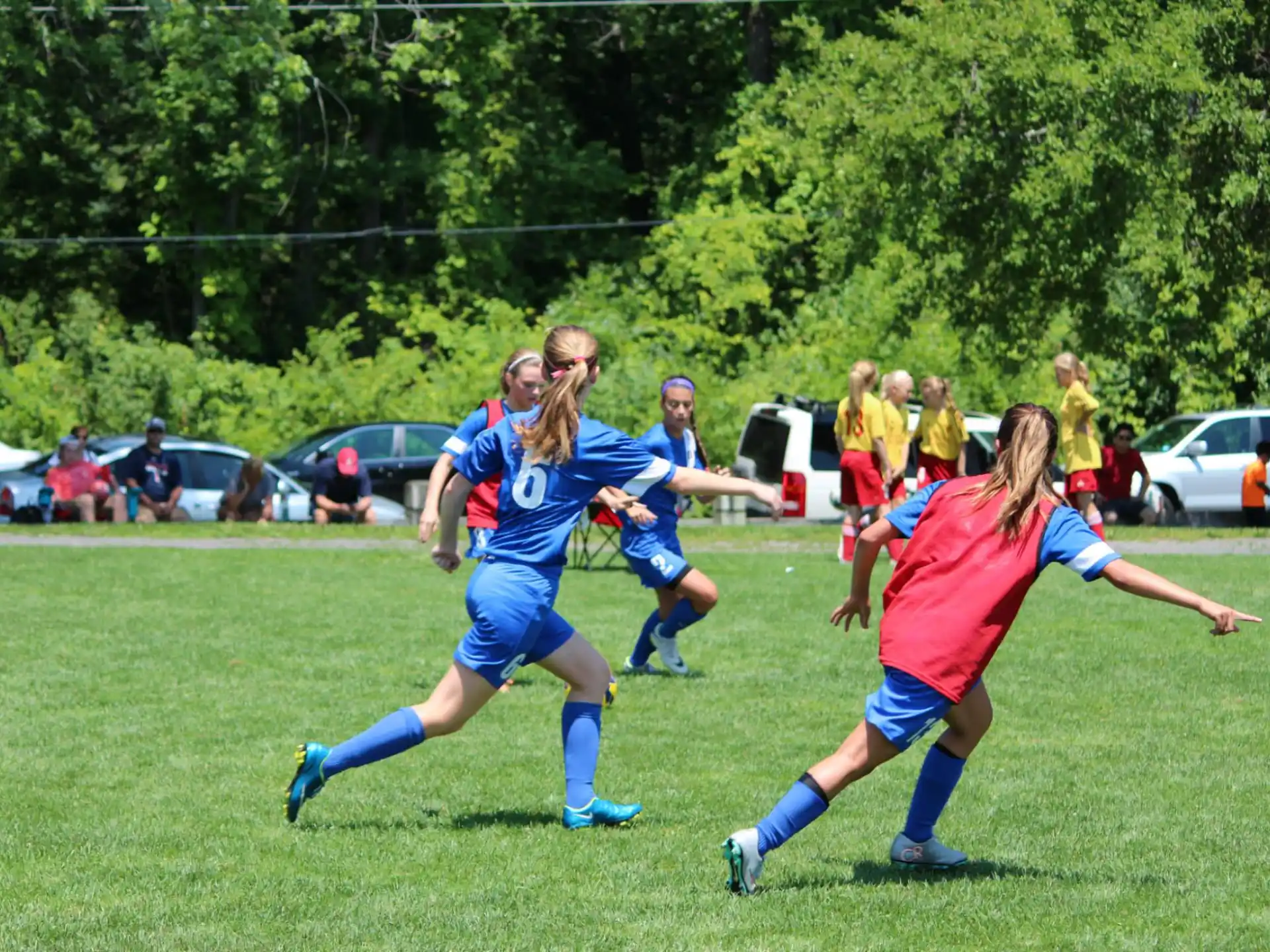 girls playing football on a field