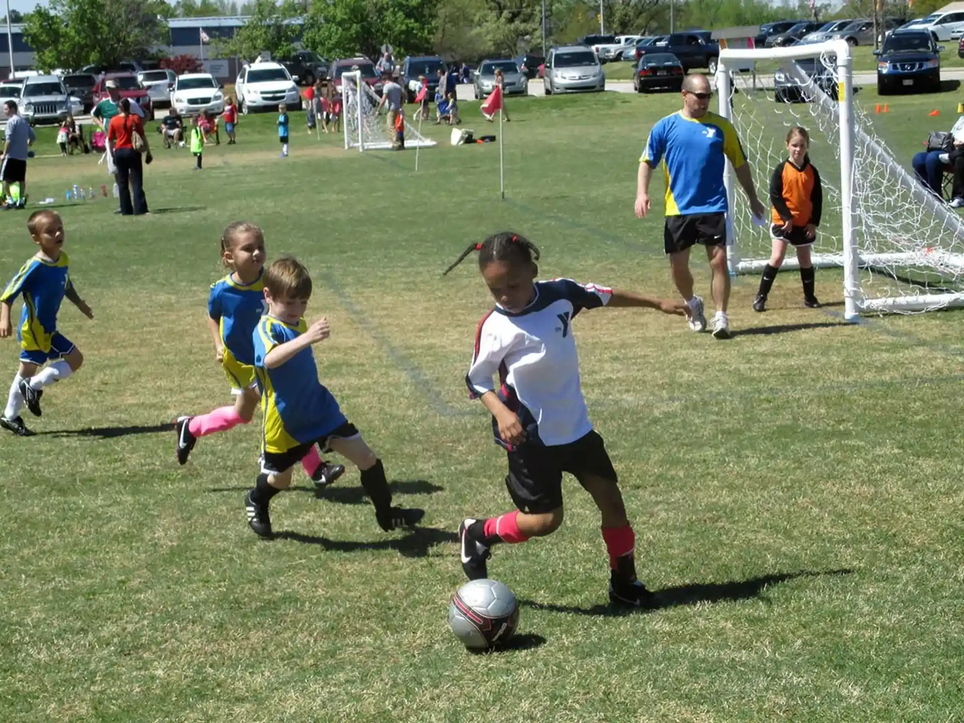 kids playing football on a field