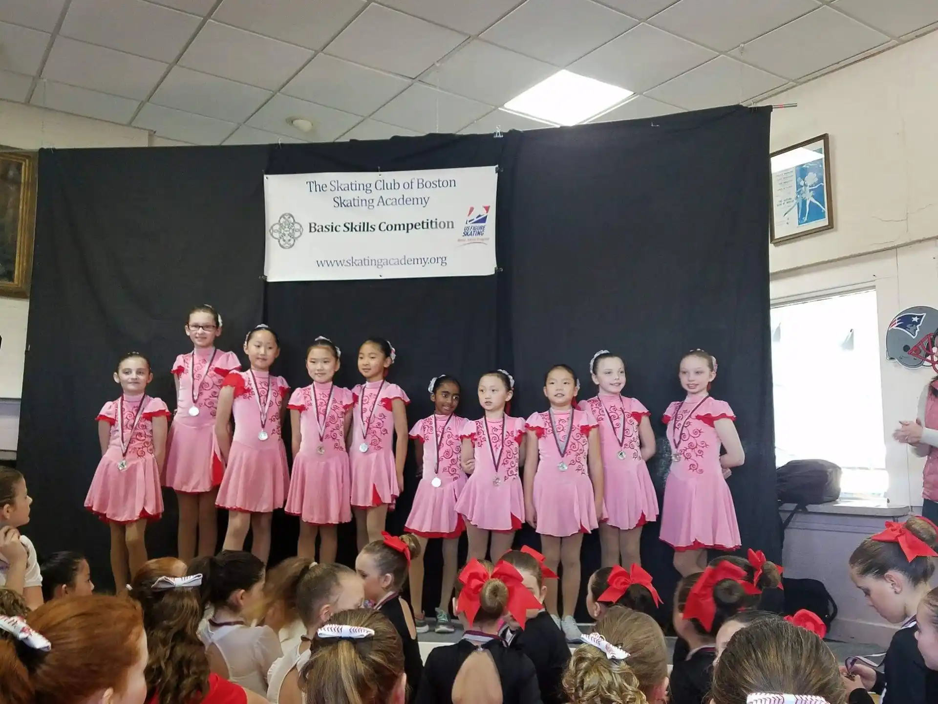a group of girls in pink dresses