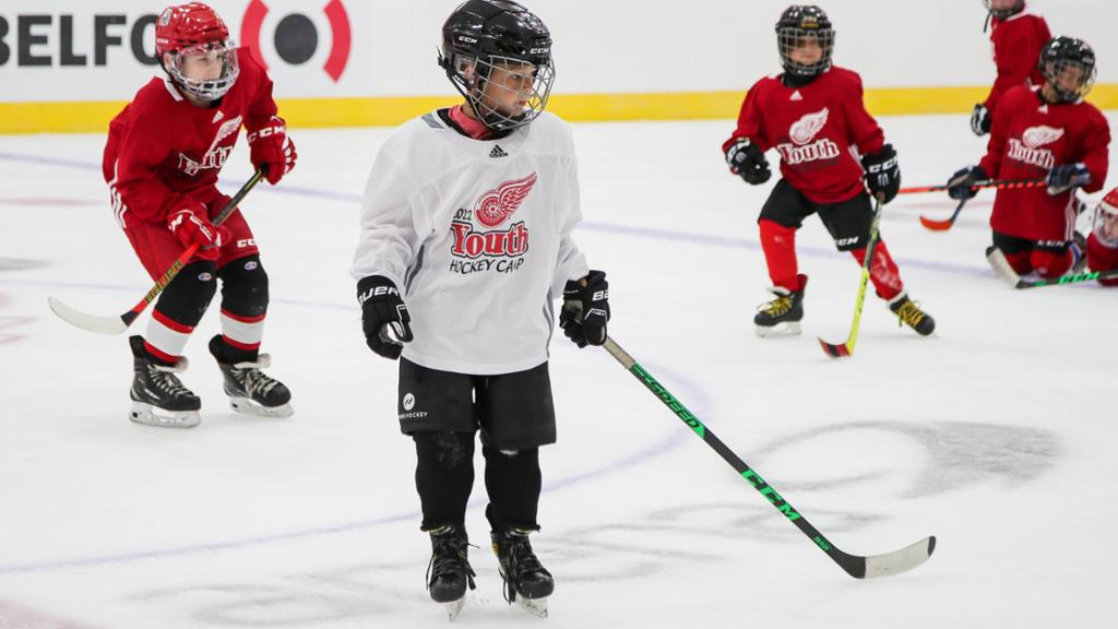 a group of people playing hockey