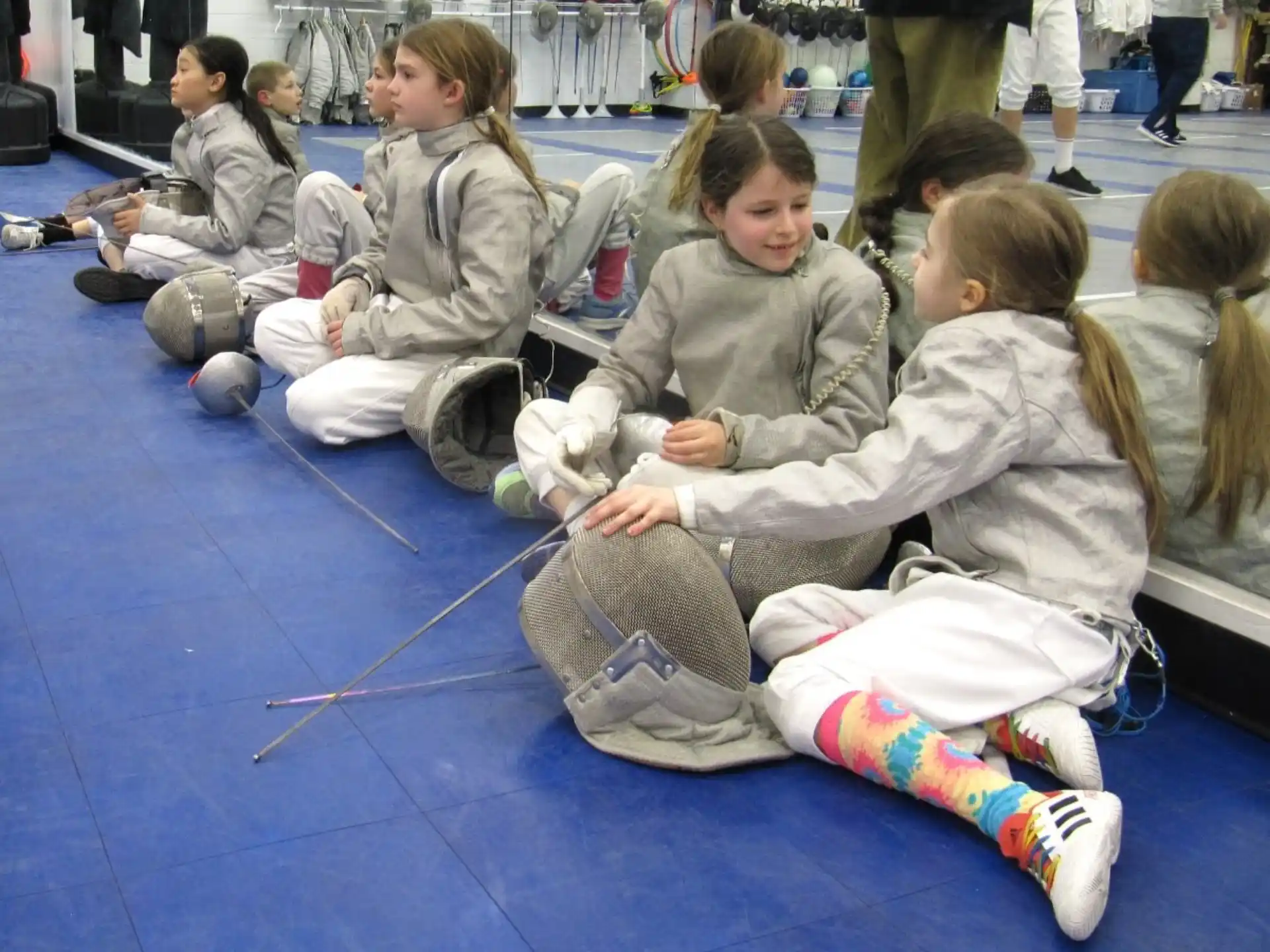 a group of children sitting on the floor