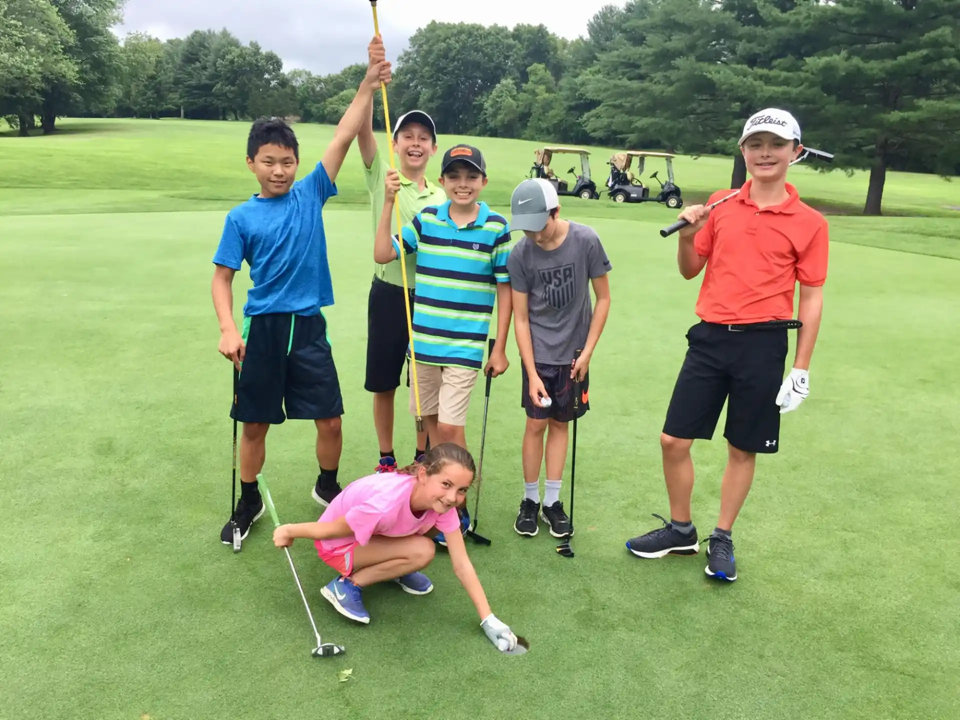 a group of people on a golf course