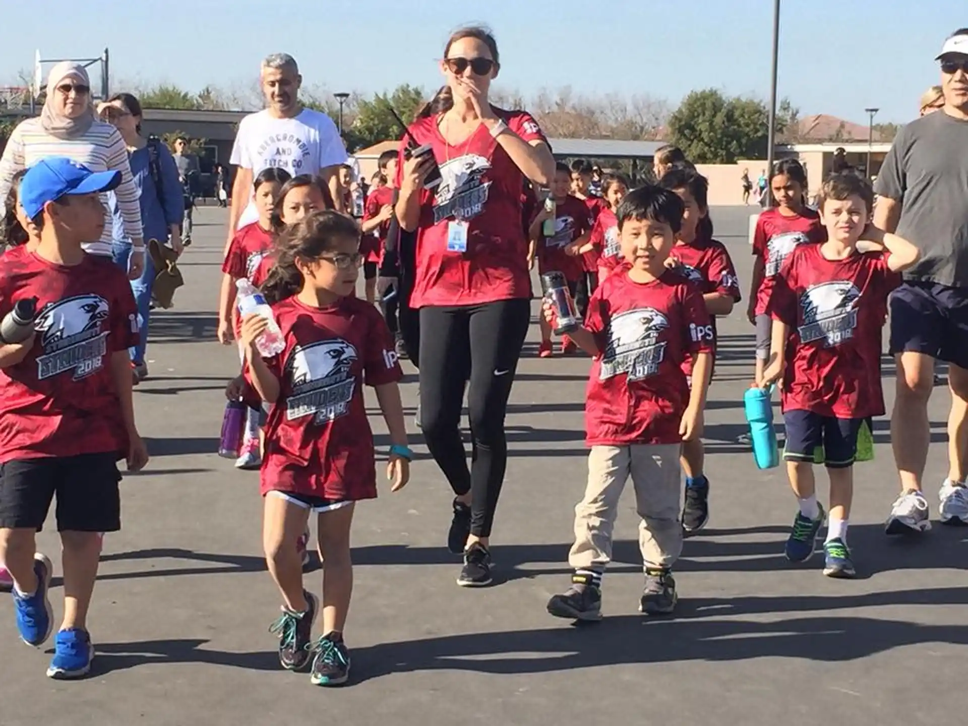 a person and several children running