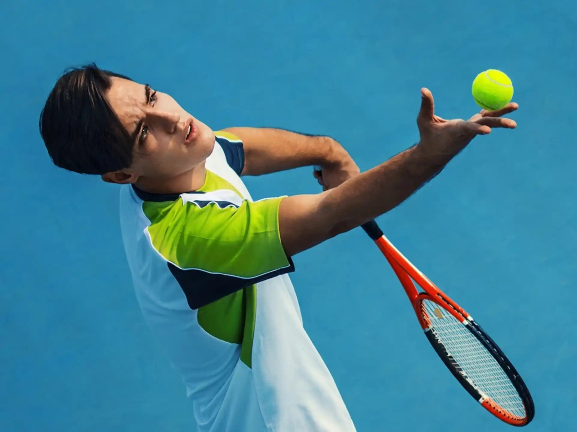 a person hitting a ball with a tennis racket