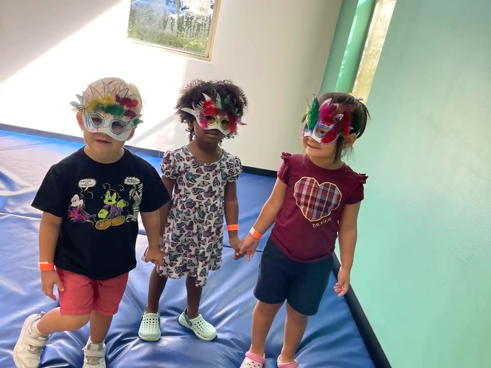 a group of children wearing masks