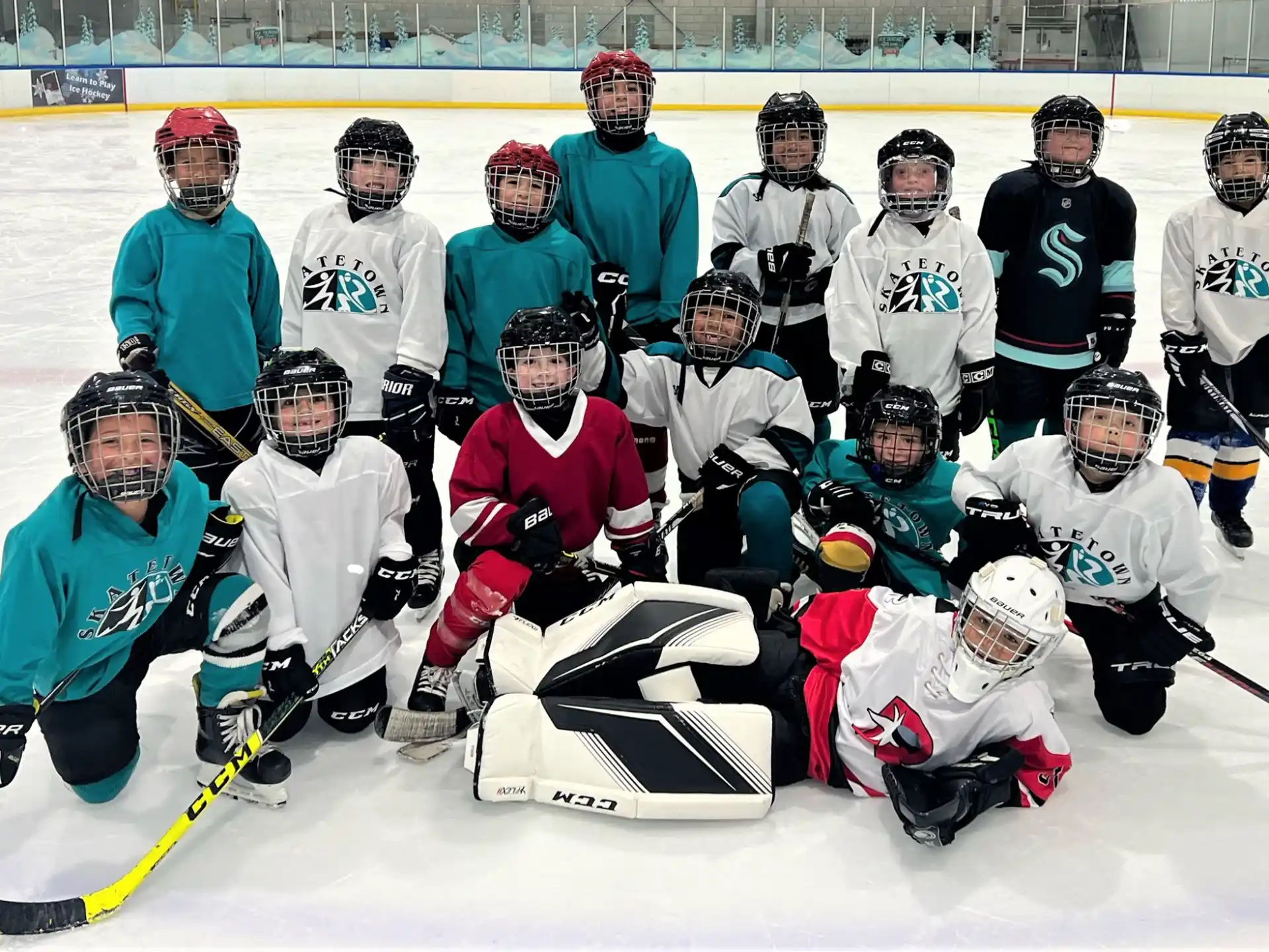 a group of hockey players posing for a photo