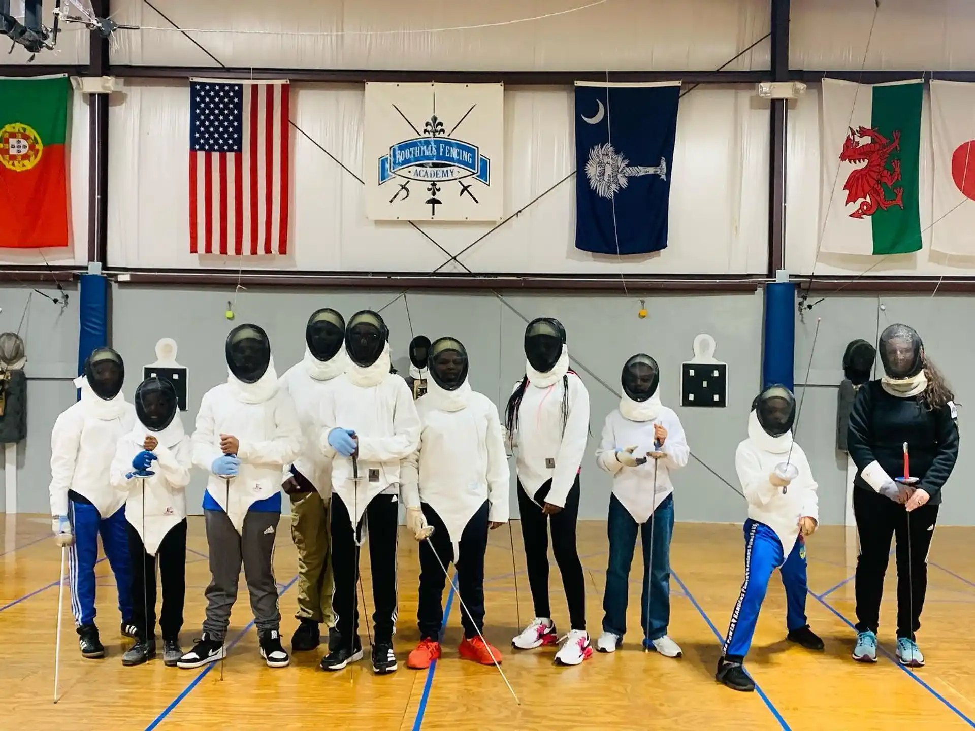 a group of people in white karate uniforms