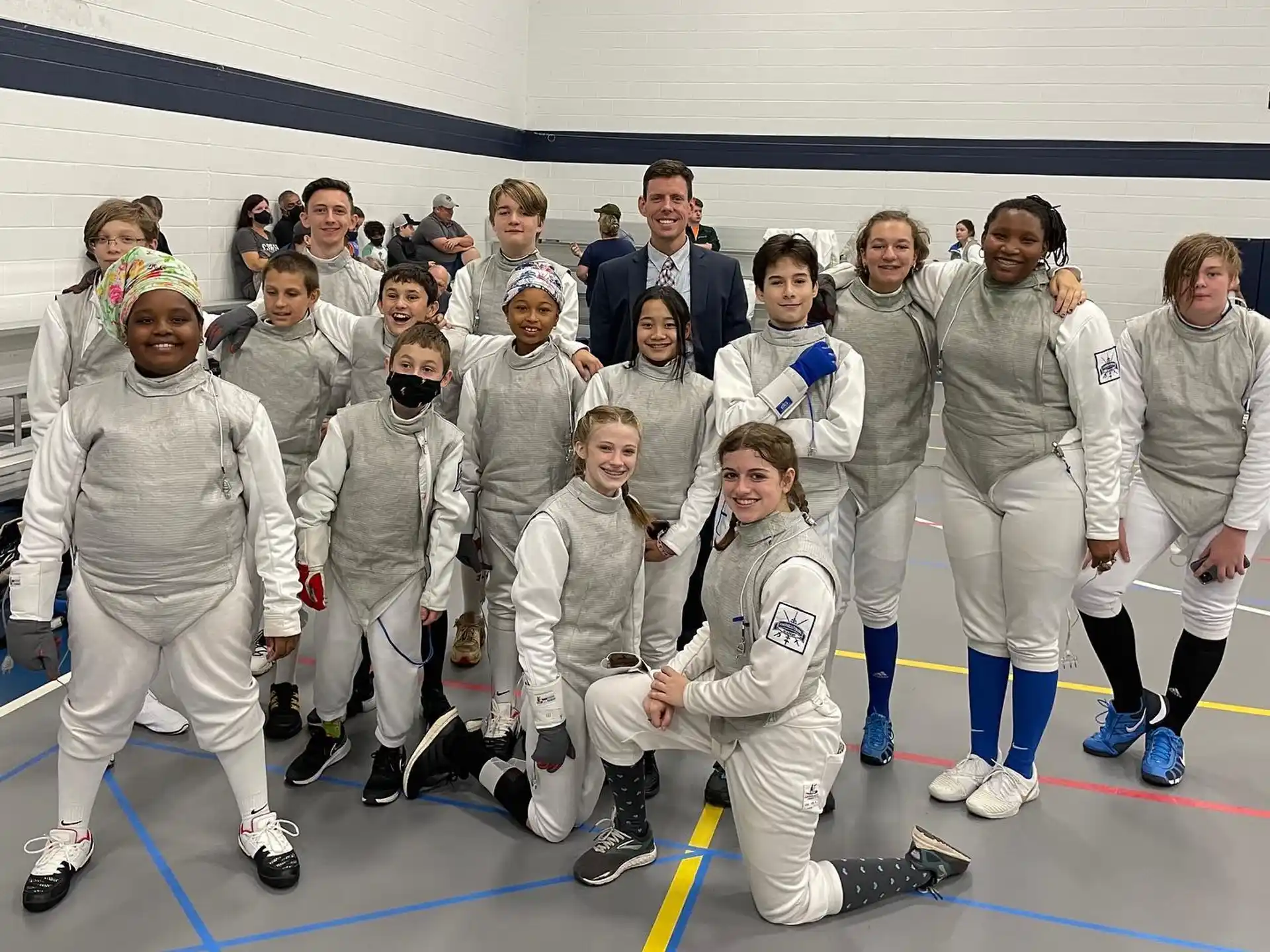 a group of people wearing white uniforms