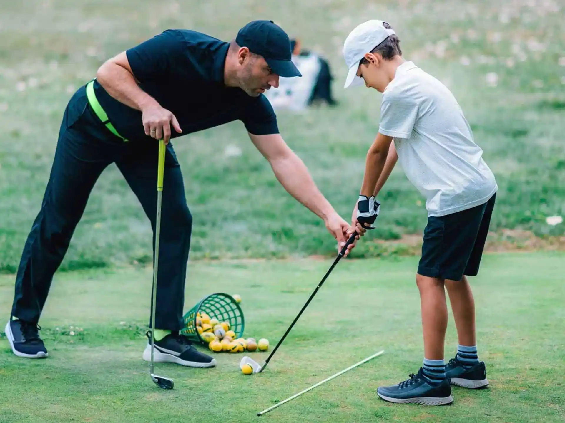 a couple of men playing golf