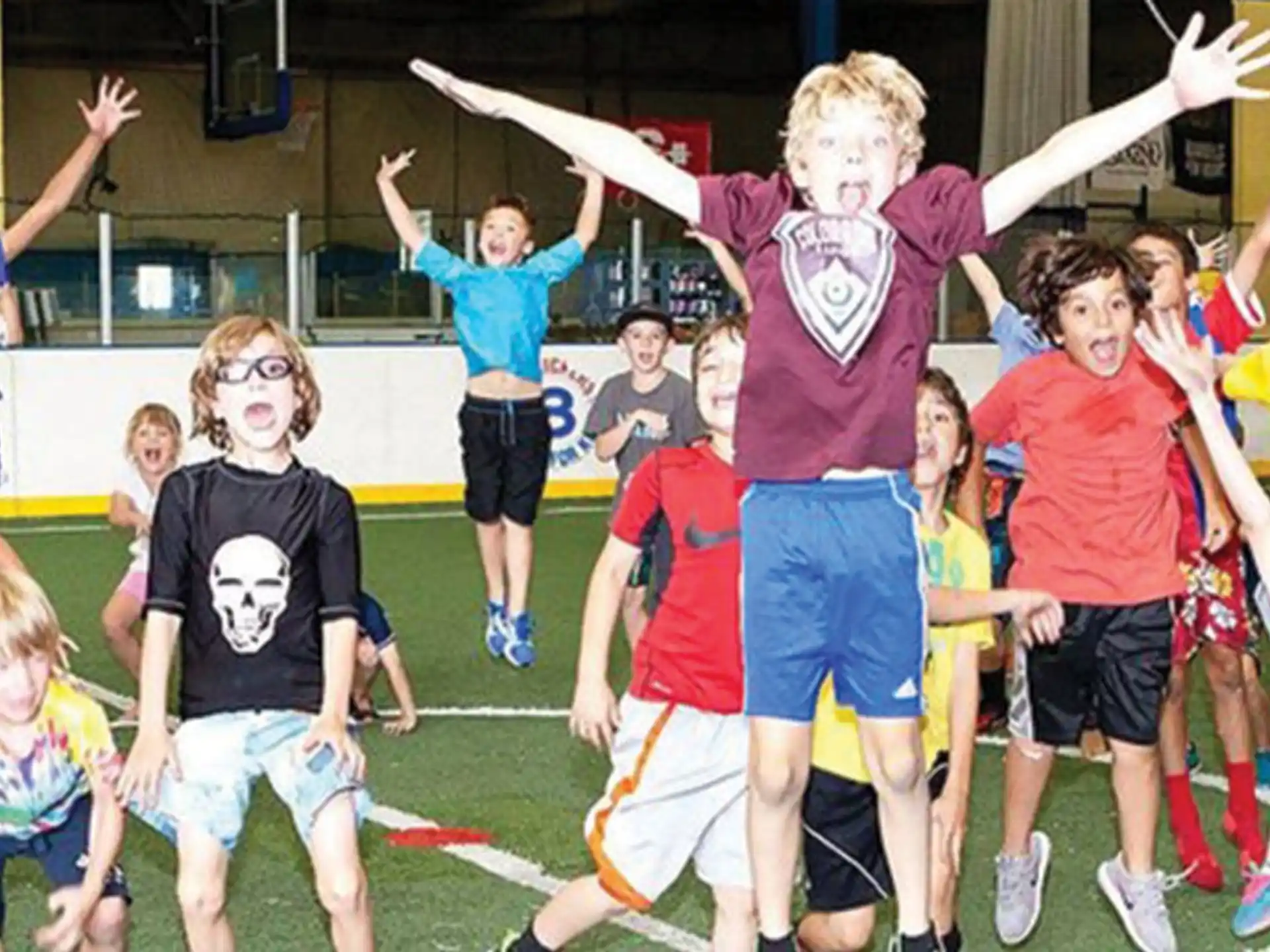 a group of children jumping in the air