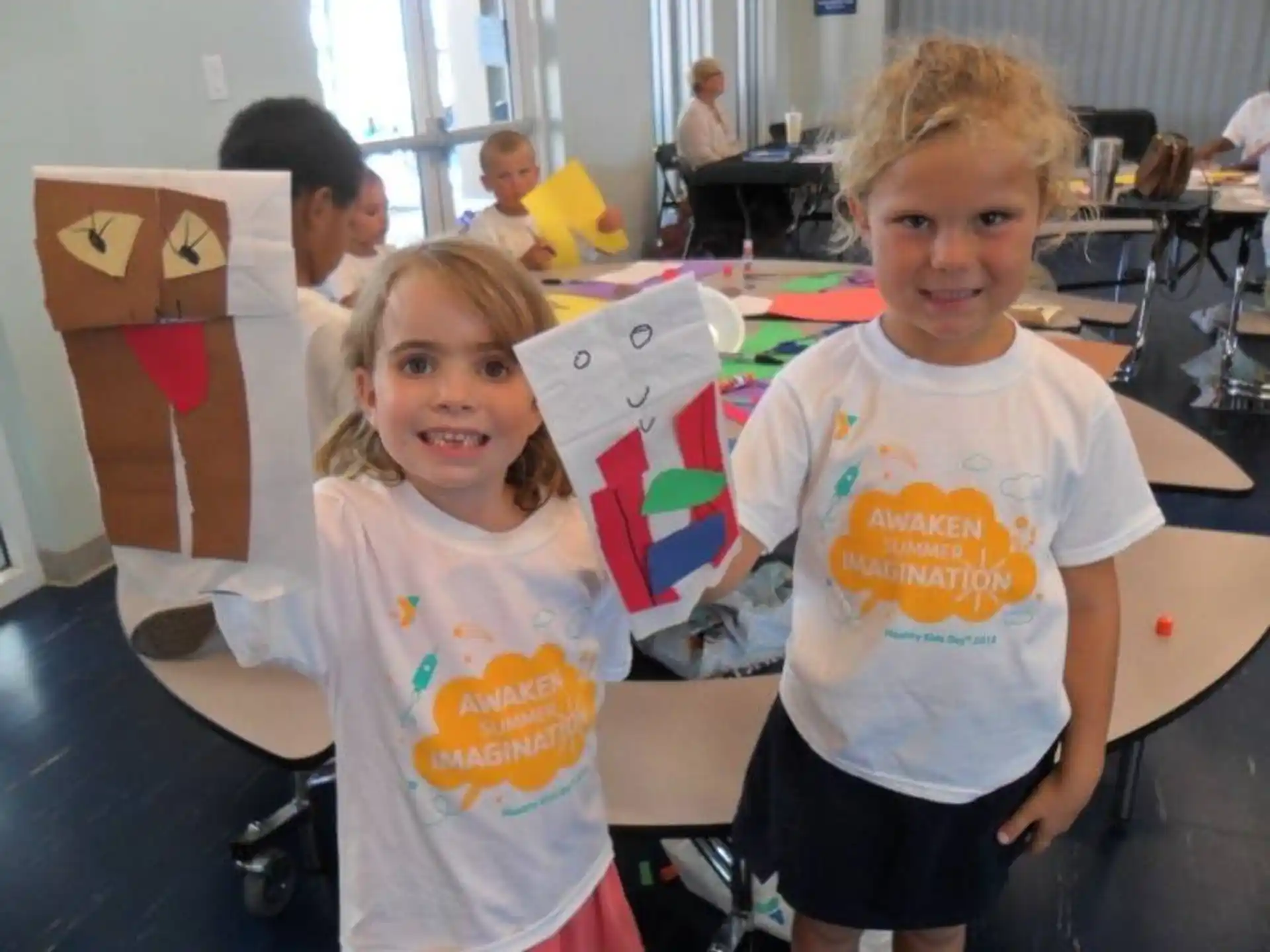 a group of children holding boxes