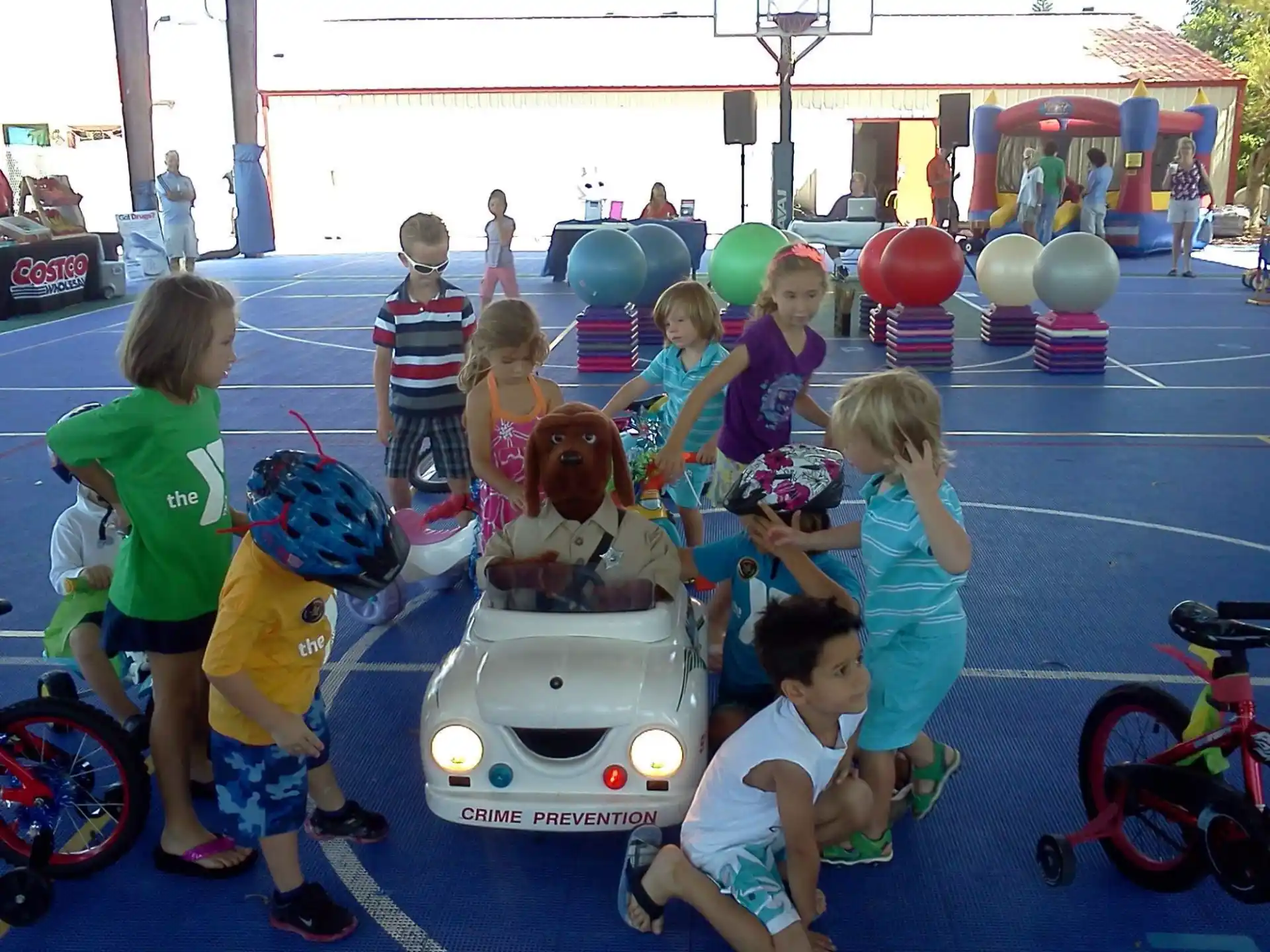 a group of children on a toy car