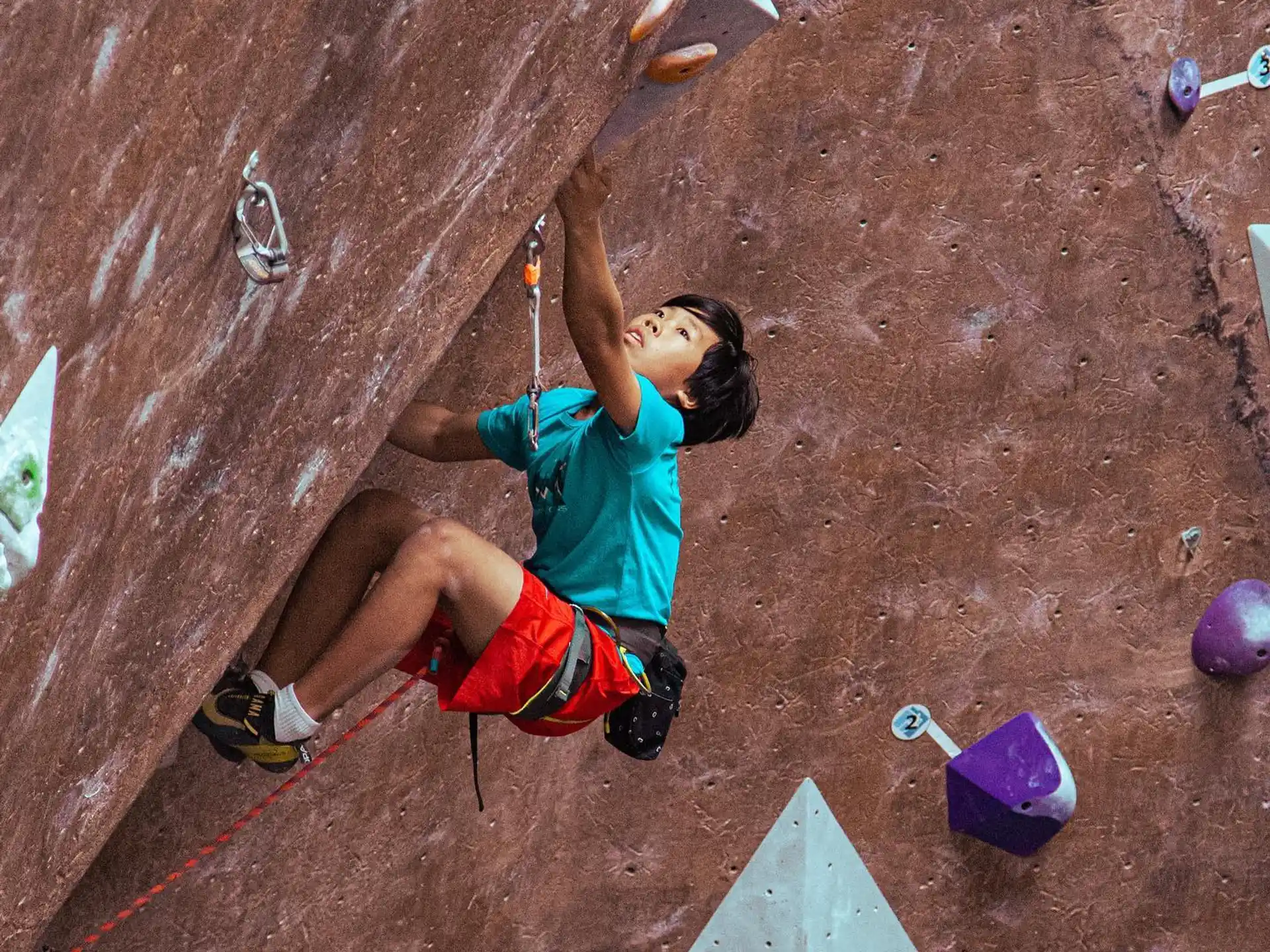 a person climbing a rock wall